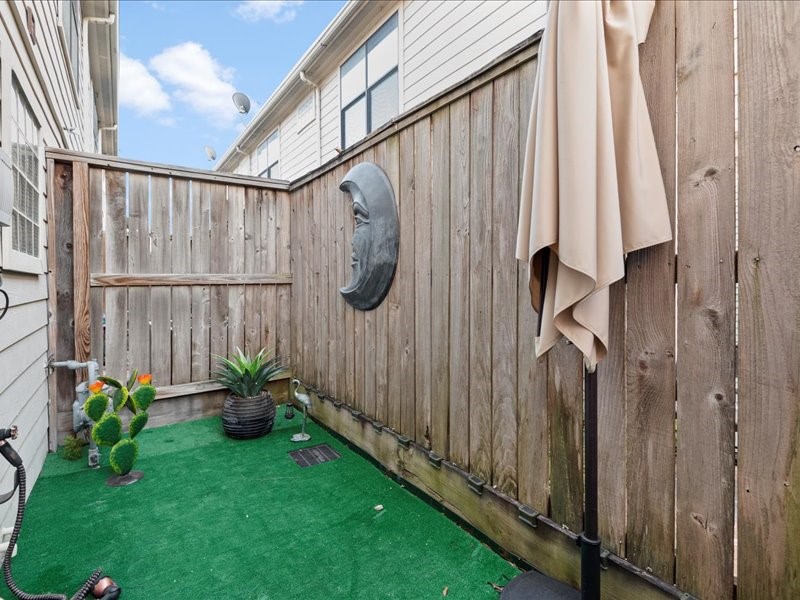 5941 South Loop E Freeway, Unit 504 Houston, TX 77033 - Photo 30 of 39 Lovely private patio. Custom installed turf grass.