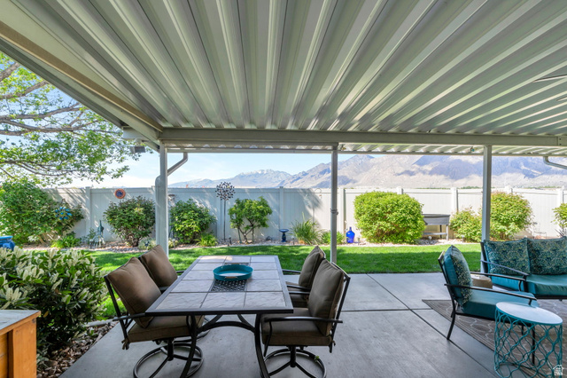 1602 Renaissance Way Springville, UT 84663 - Photo 31 of 42 Fenced backyard featuring outdoor dining space, a mountain view, and a patio
