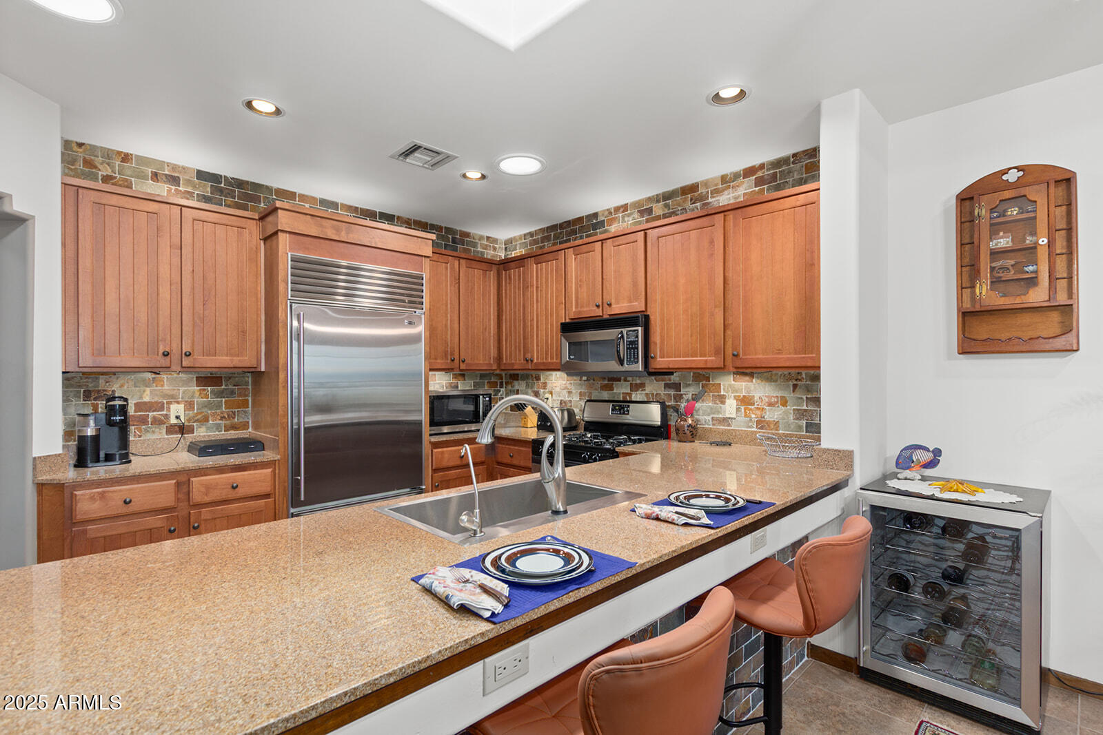 36601 North Mule Train Road, Unit 45B Carefree, AZ 85377 - Photo 11 of 41 a kitchen with a refrigerator a stove a sink and cabinets