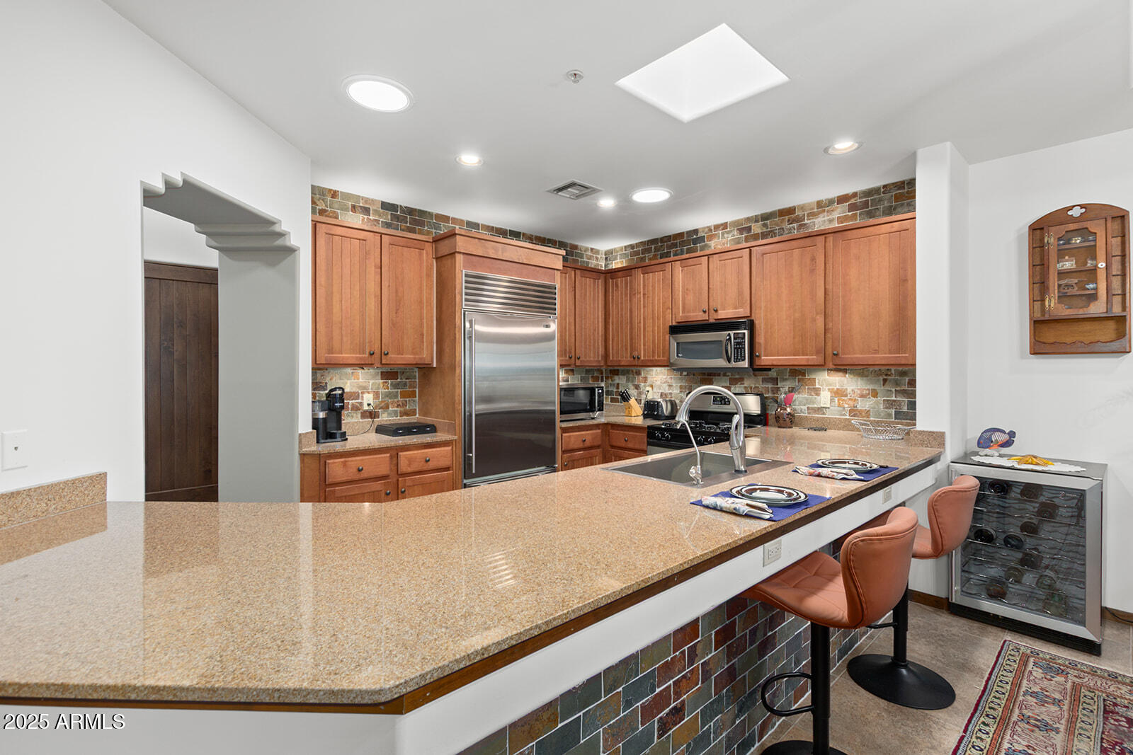 36601 North Mule Train Road, Unit 45B Carefree, AZ 85377 - Photo 13 of 41 a kitchen with a refrigerator a stove a sink and cabinets