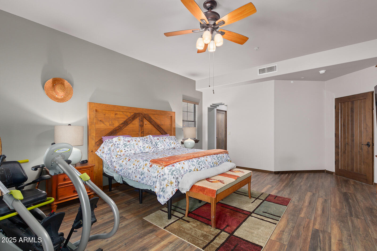 36601 North Mule Train Road, Unit 45B Carefree, AZ 85377 - Photo 15 of 41 a bedroom with a bed and wooden floor