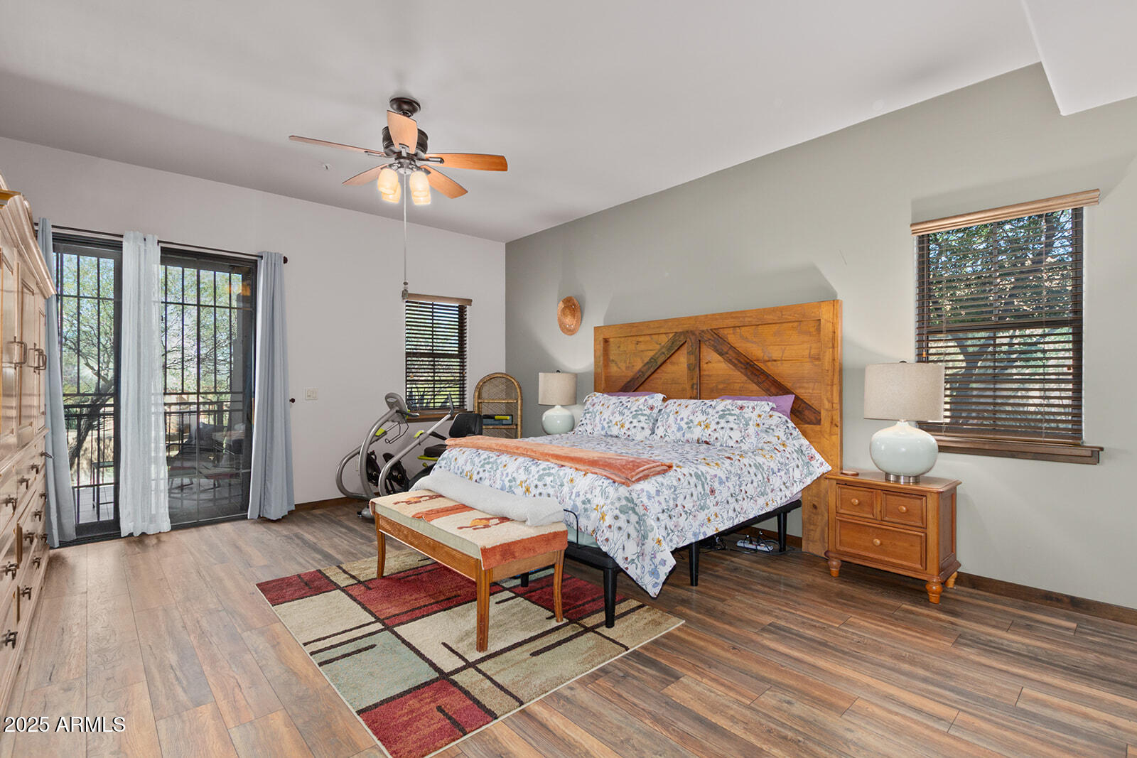 36601 North Mule Train Road, Unit 45B Carefree, AZ 85377 - Photo 16 of 41 a bedroom with a bed and wooden floor