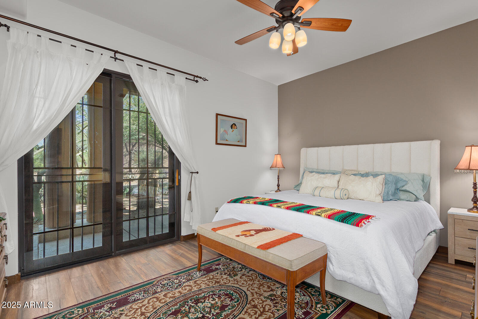 36601 North Mule Train Road, Unit 45B Carefree, AZ 85377 - Photo 25 of 41 a bedroom with a bed a chandelier and dresser