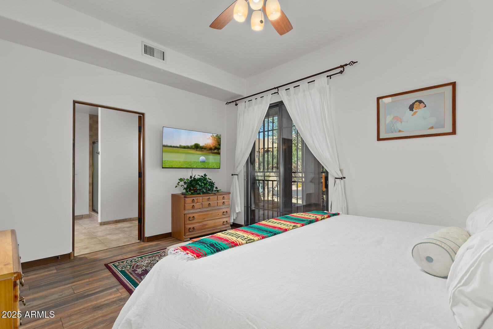 36601 North Mule Train Road, Unit 45B Carefree, AZ 85377 - Photo 26 of 41 a bedroom with a bed and a large window