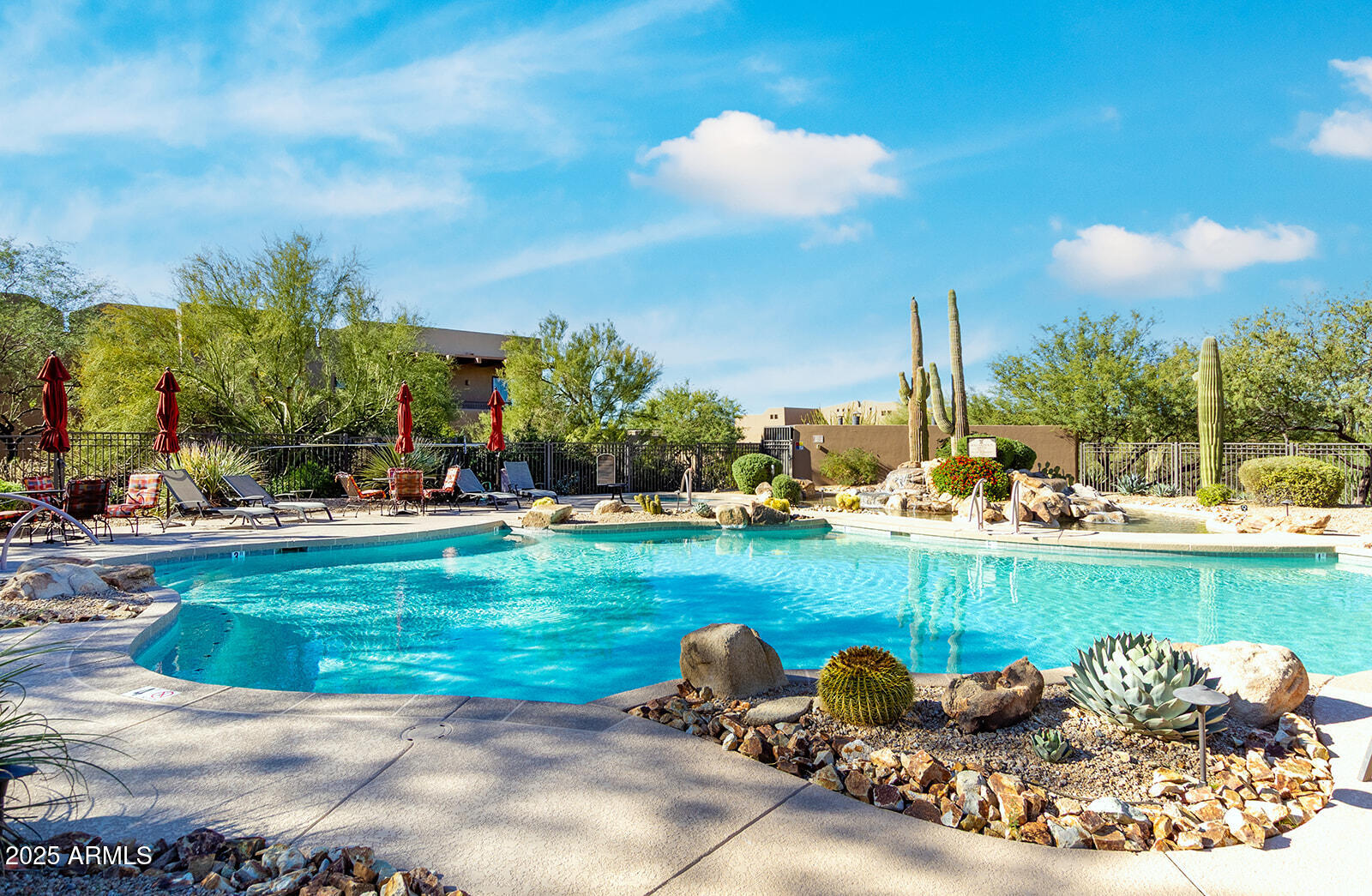 36601 North Mule Train Road, Unit 45B Carefree, AZ 85377 - Photo 35 of 41 a view of a swimming pool and a back yard