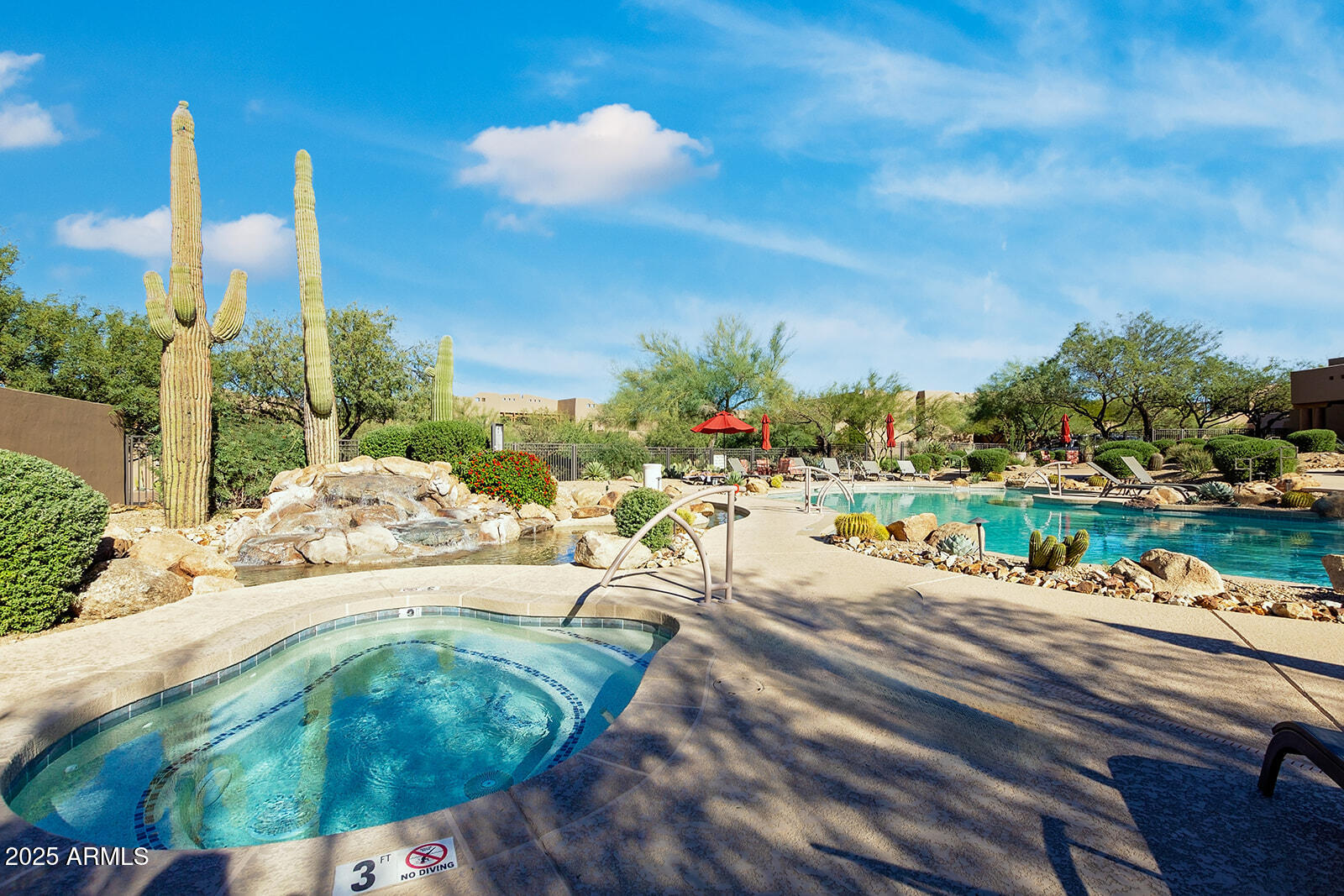 36601 North Mule Train Road, Unit 45B Carefree, AZ 85377 - Photo 37 of 41 a view of a swimming pool with a patio and garden