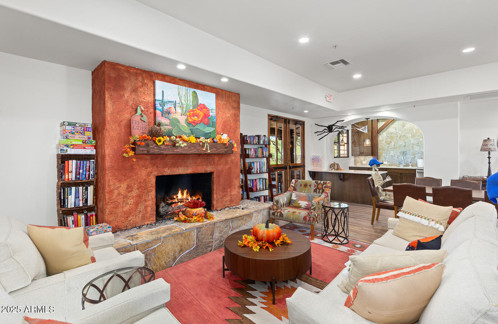 36601 North Mule Train Road, Unit 45B Carefree, AZ 85377 - Photo 39 of 41 a living room with furniture a fireplace and a flat screen tv