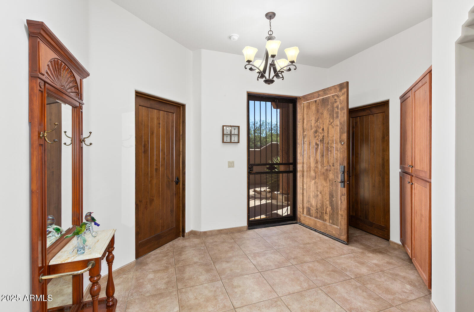 36601 North Mule Train Road, Unit 45B Carefree, AZ 85377 - Photo 4 of 41 a view of a livingroom with a chandelier closet and windows