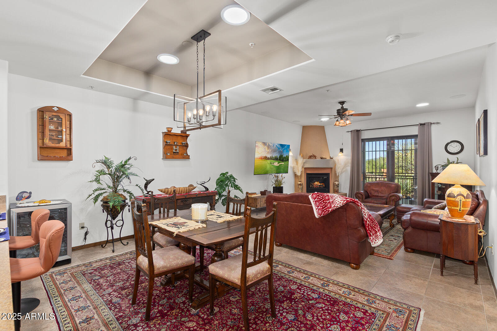 36601 North Mule Train Road, Unit 45B Carefree, AZ 85377 - Photo 6 of 41 a living room with furniture a chandelier and a table