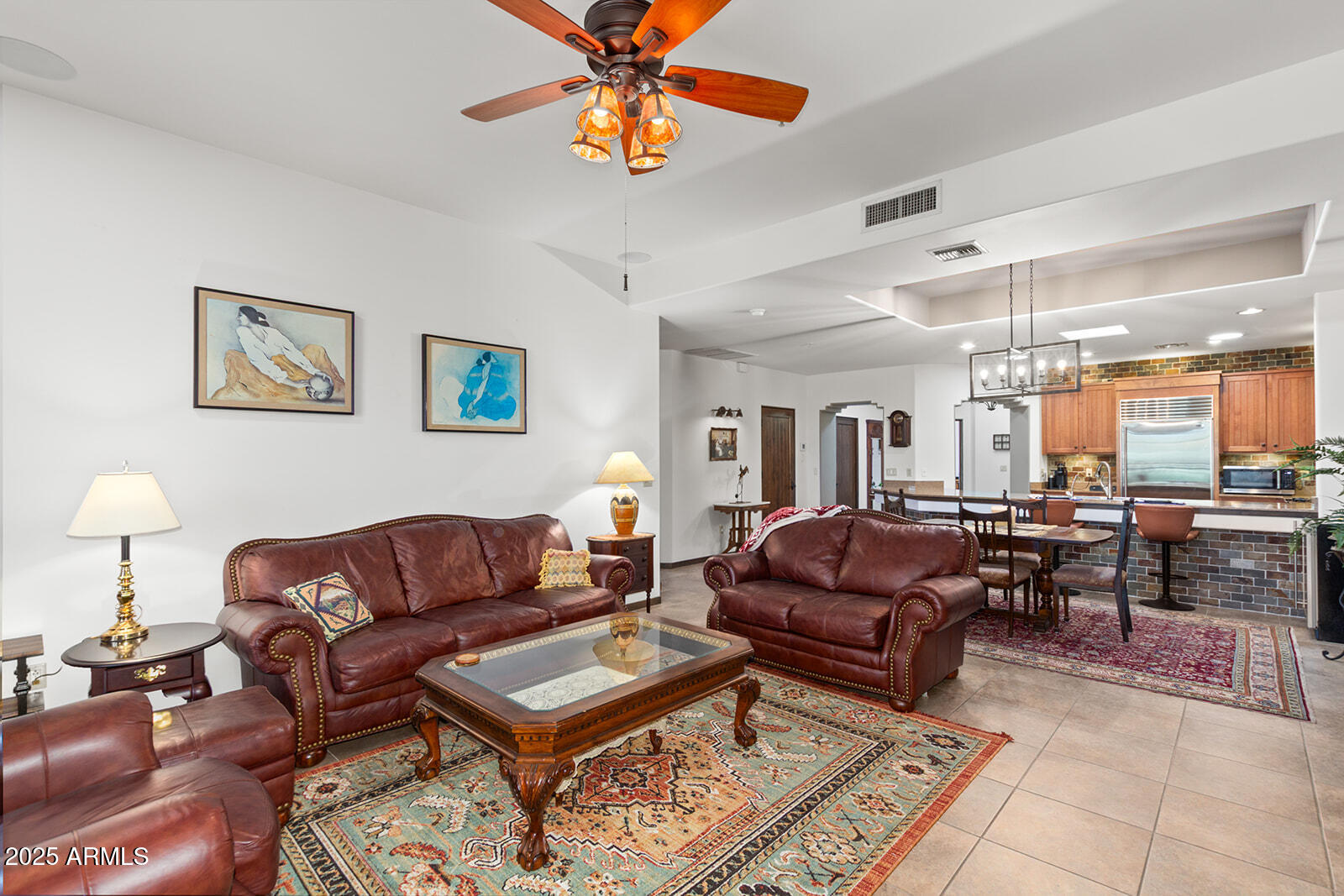 36601 North Mule Train Road, Unit 45B Carefree, AZ 85377 - Photo 9 of 41 a living room with furniture a dining table and a piano table