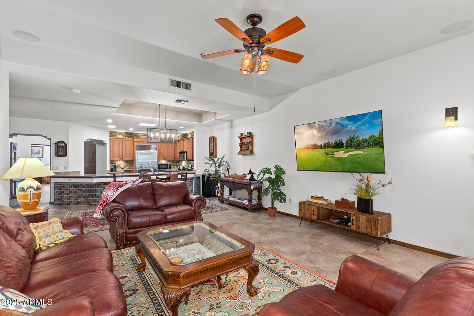 36601 North Mule Train Road, Unit 45B Carefree, AZ 85377 - Photo 10 of 41 a living room with furniture a flat screen tv and a large window