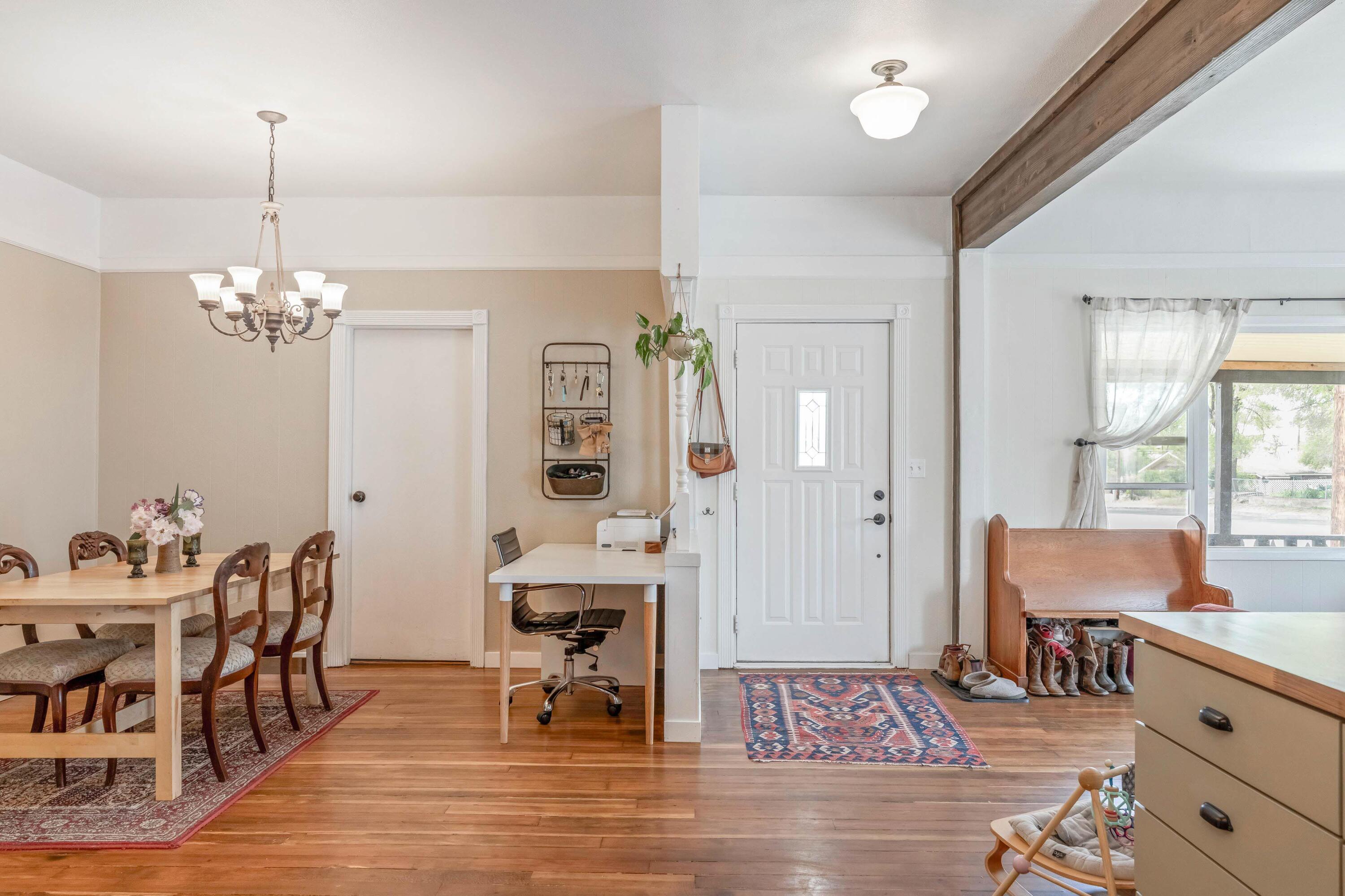 496 Southwest 2nd Street Madras, OR 97741 - Photo 12 of 37 a view of a dining room with furniture and wooden floor