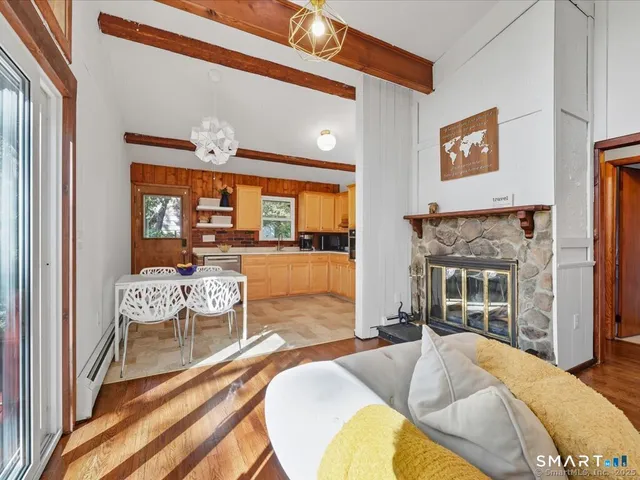 a bedroom with furniture and a fireplace