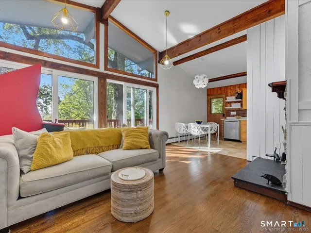 a living room with furniture and a large window