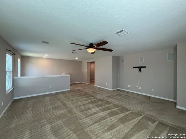a view of hallway with wooden floor