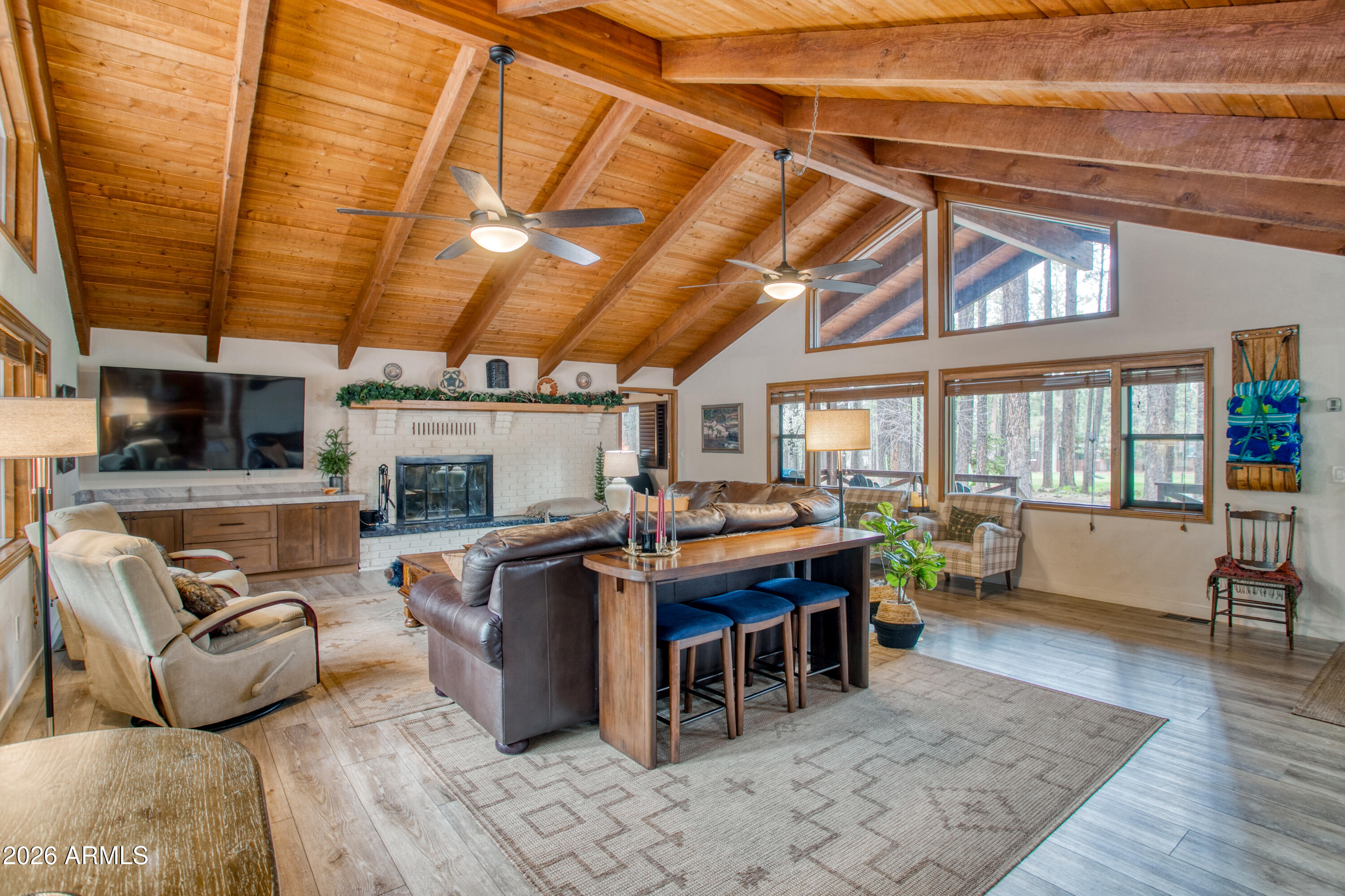 7414 Geronimo Road Pinetop, AZ 85935 - Photo 11 of 67 a living room with furniture and wooden floor