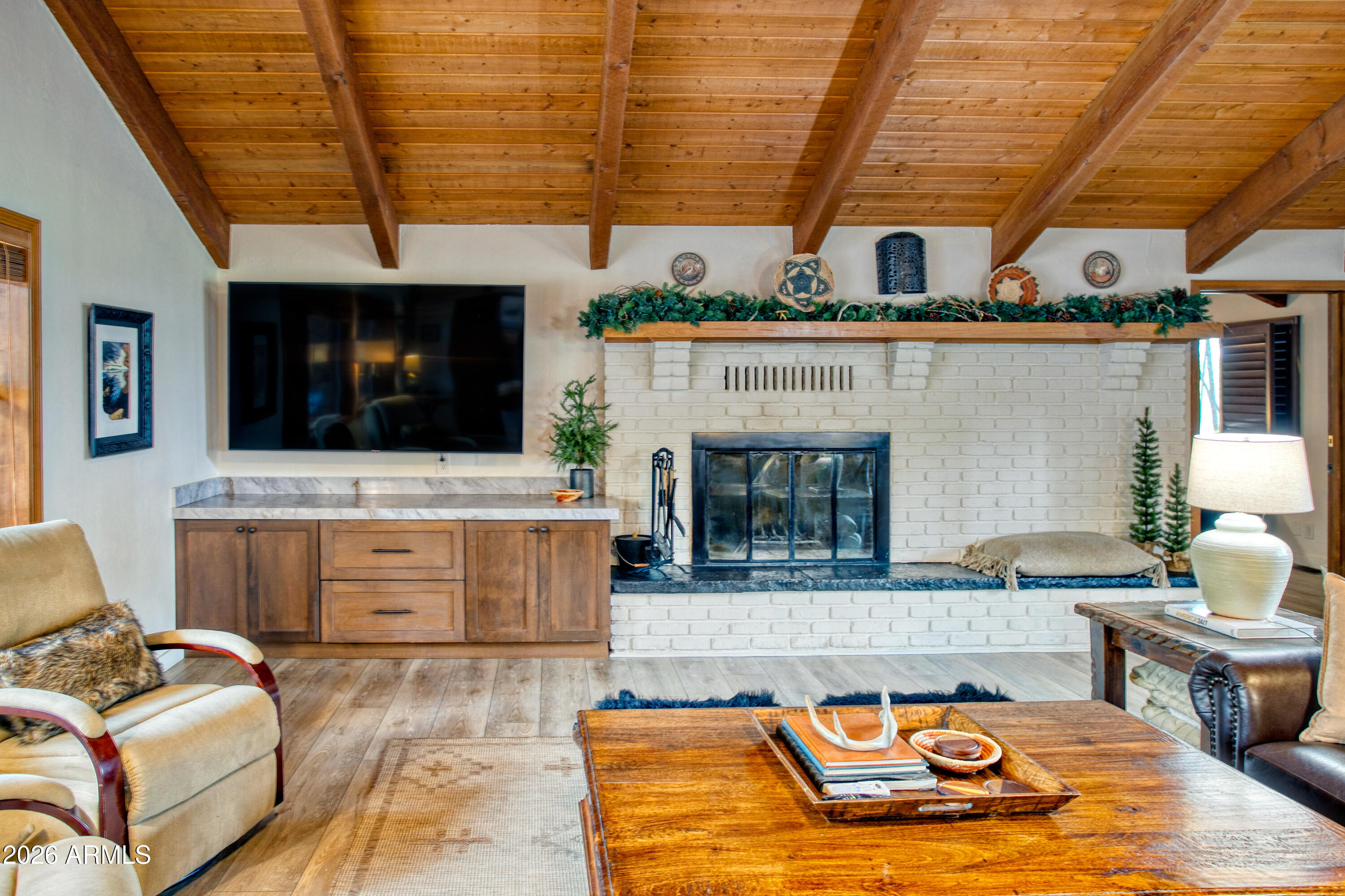 7414 Geronimo Road Pinetop, AZ 85935 - Photo 12 of 67 a living room with furniture and a flat screen tv