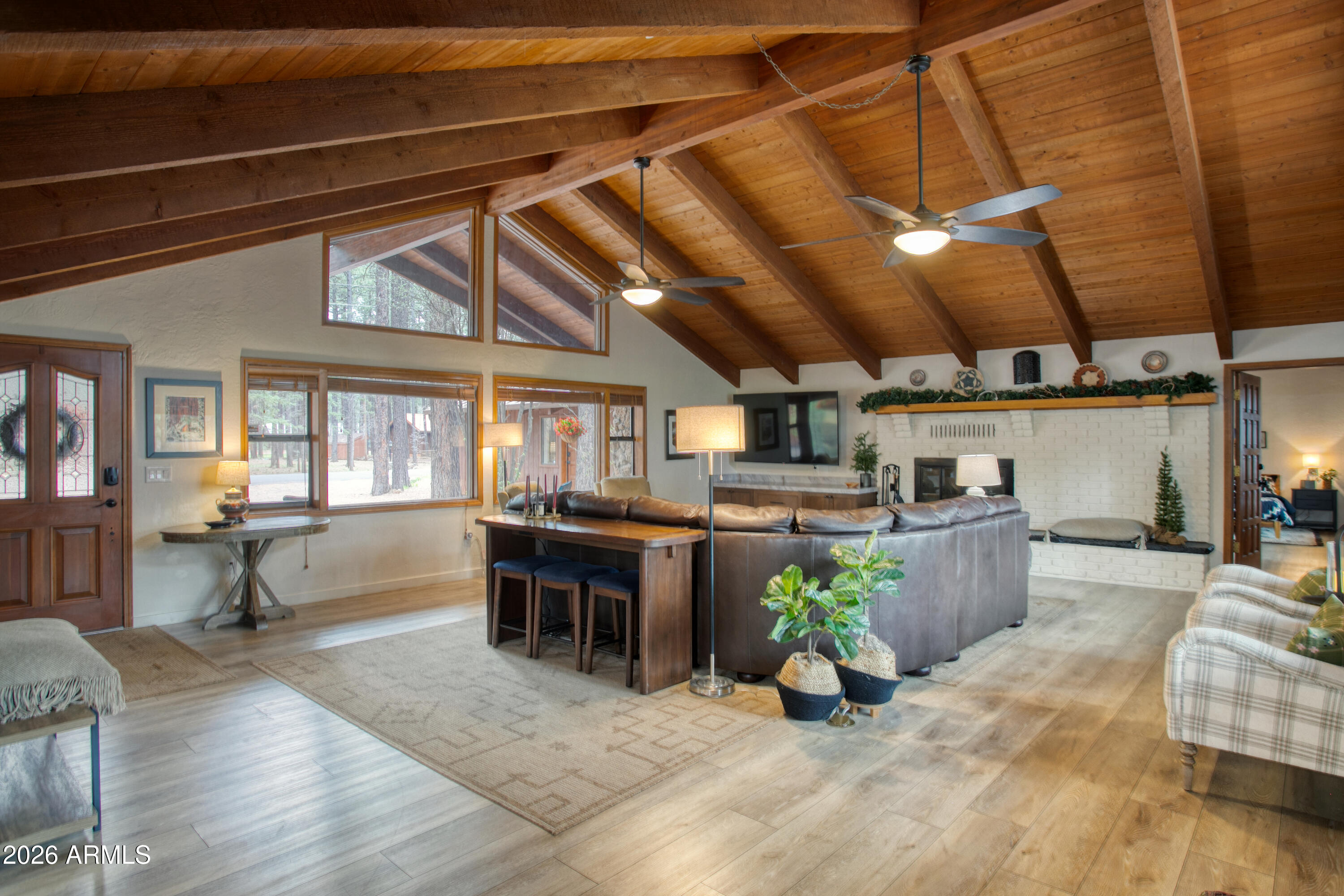 7414 Geronimo Road Pinetop, AZ 85935 - Photo 13 of 67 a view of a patio with table and chairs barbeque potted plants