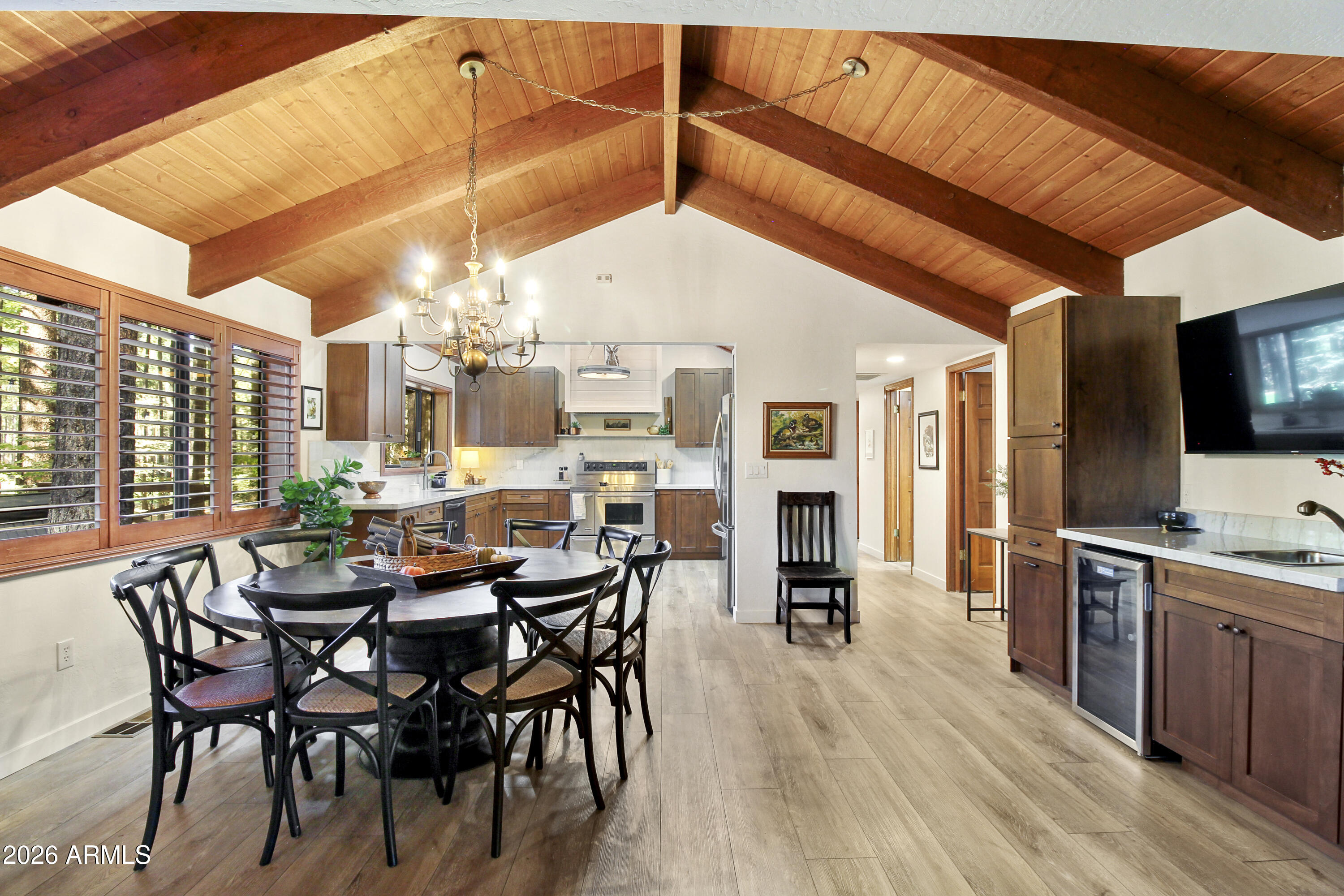 7414 Geronimo Road Pinetop, AZ 85935 - Photo 17 of 67 a dining room with furniture window and wooden floor