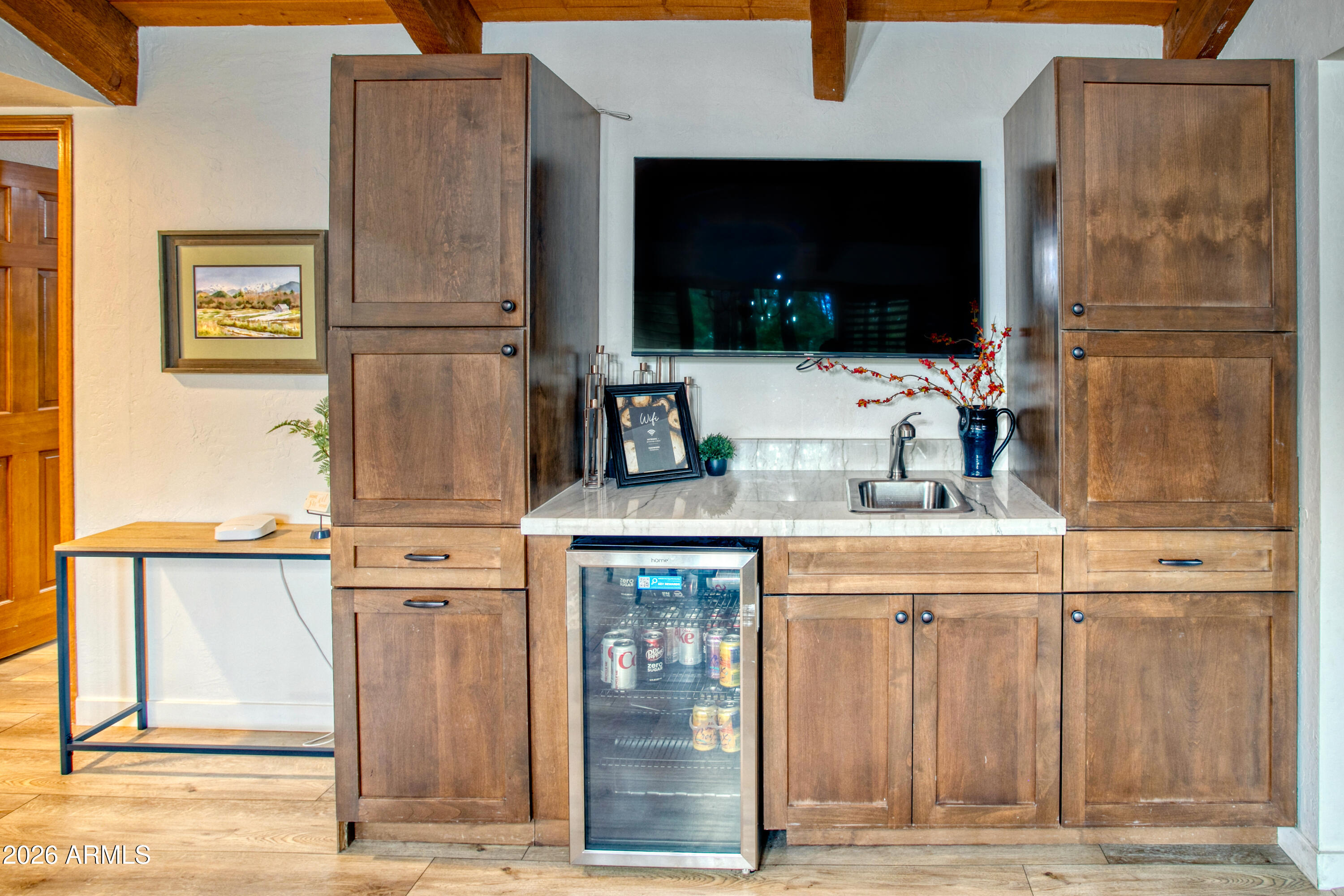 7414 Geronimo Road Pinetop, AZ 85935 - Photo 22 of 67 a kitchen with a sink and a refrigerator