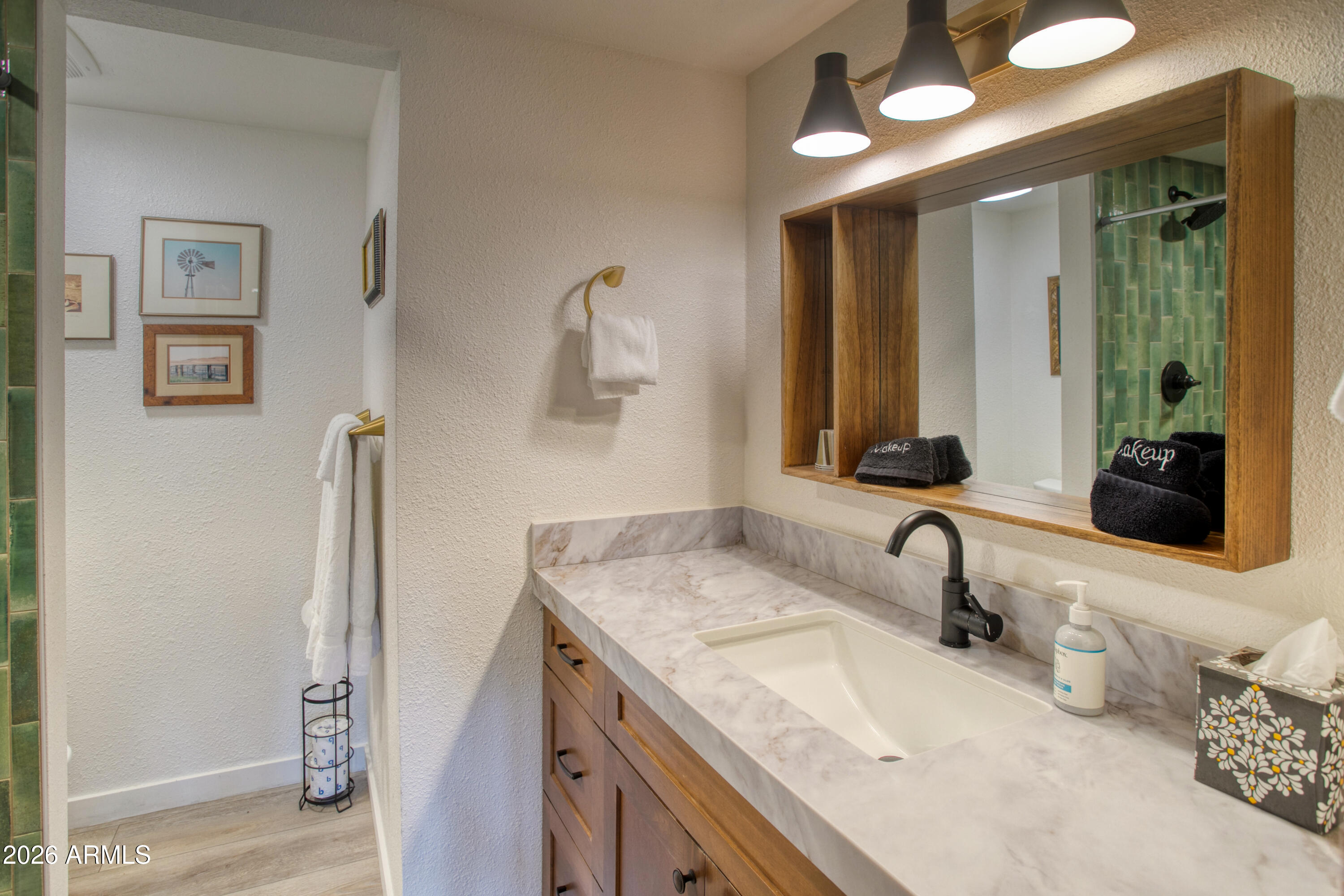 7414 Geronimo Road Pinetop, AZ 85935 - Photo 27 of 67 a bathroom with double vanity sink and a mirror