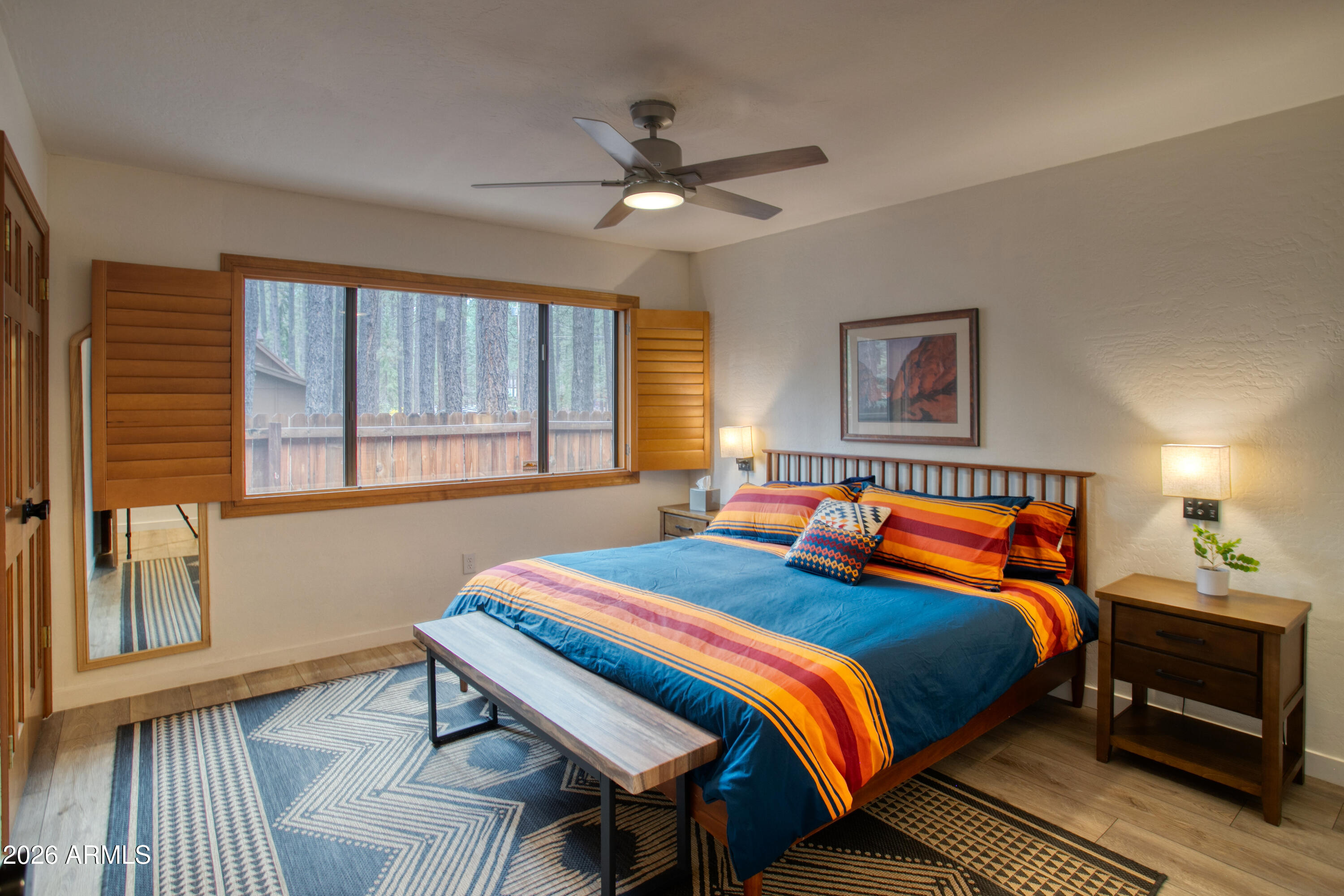 7414 Geronimo Road Pinetop, AZ 85935 - Photo 29 of 67 a bedroom with a bed and a window