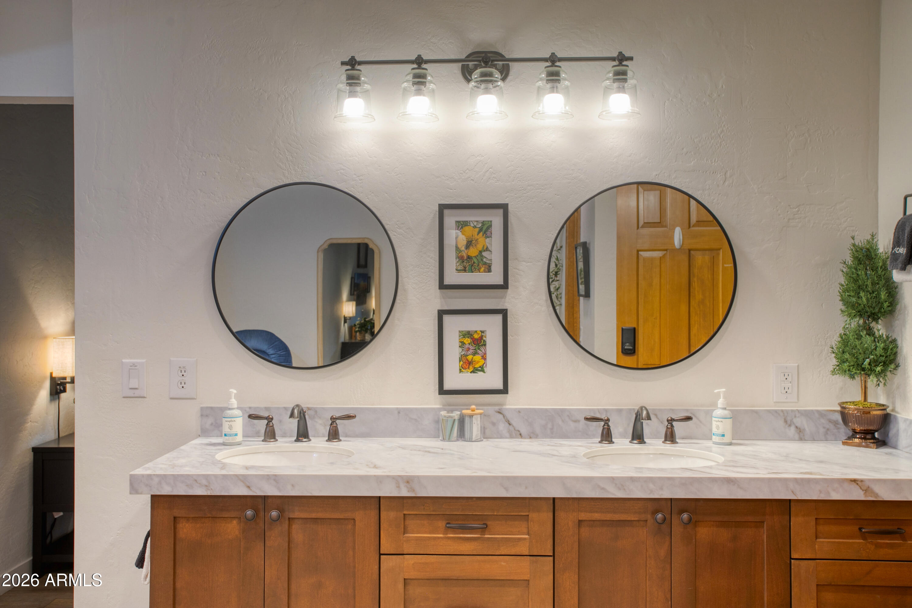 7414 Geronimo Road Pinetop, AZ 85935 - Photo 36 of 67 a bathroom with a granite countertop double vanity sinks and a mirror