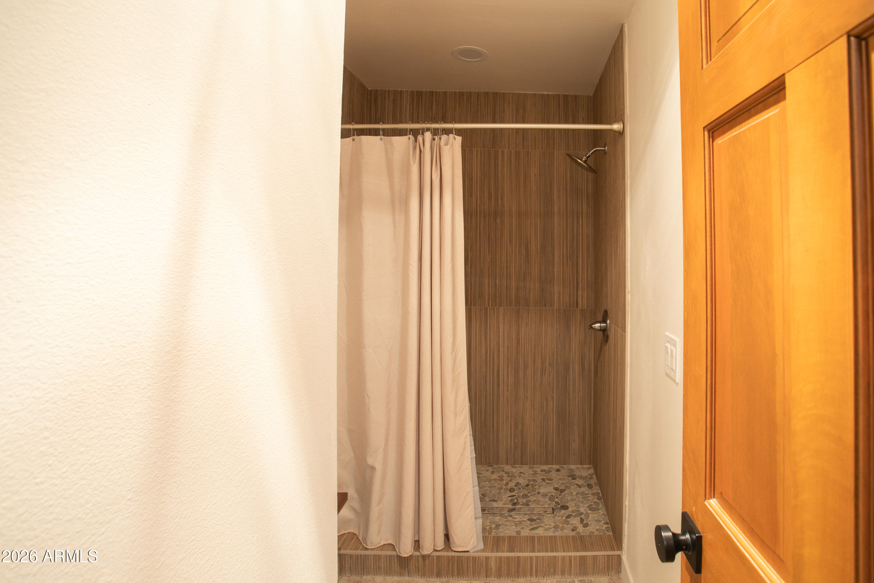 7414 Geronimo Road Pinetop, AZ 85935 - Photo 38 of 67 a bathroom with a shower and a window