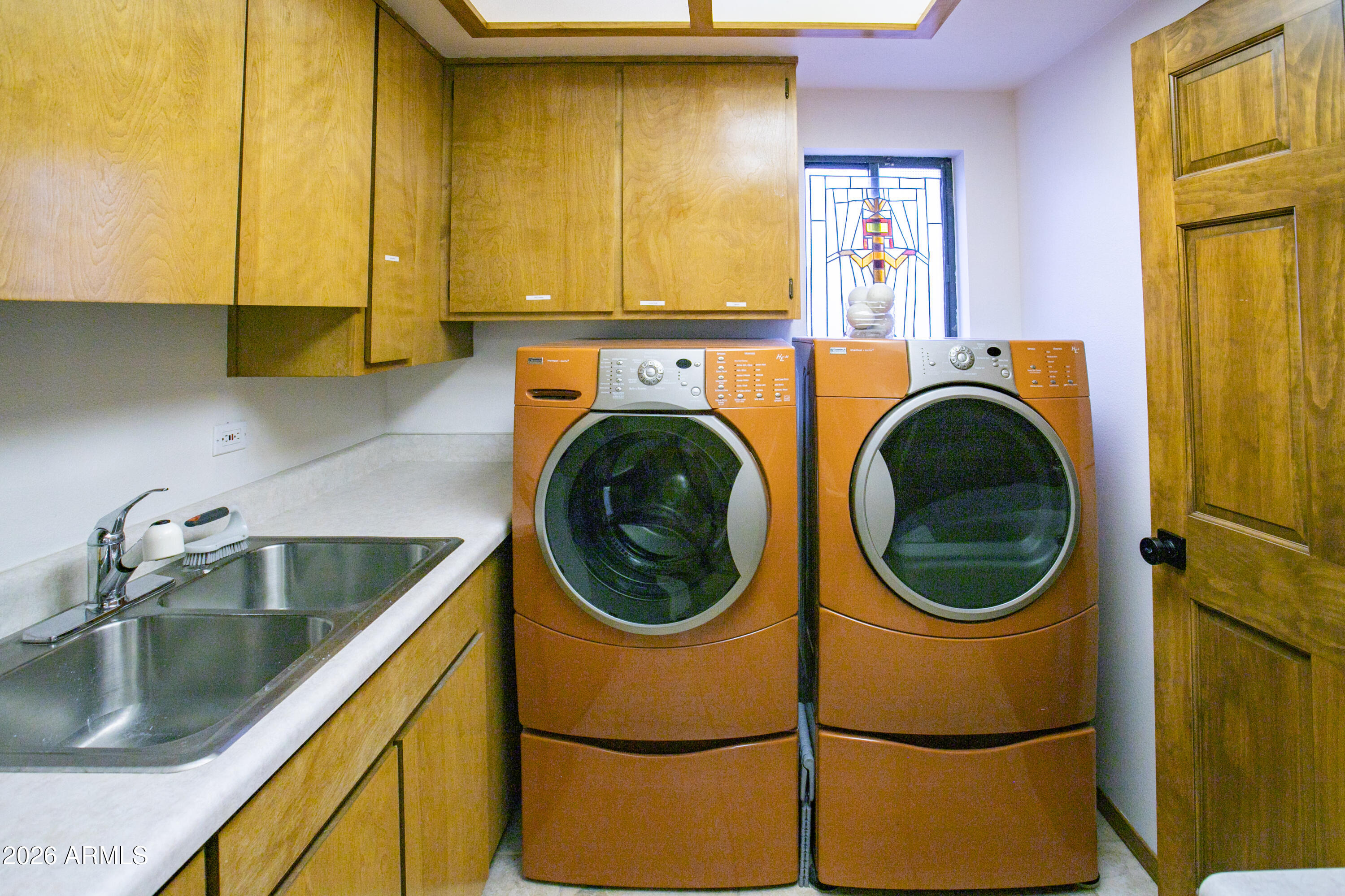 7414 Geronimo Road Pinetop, AZ 85935 - Photo 39 of 67 a utility room with sink dryer and washer