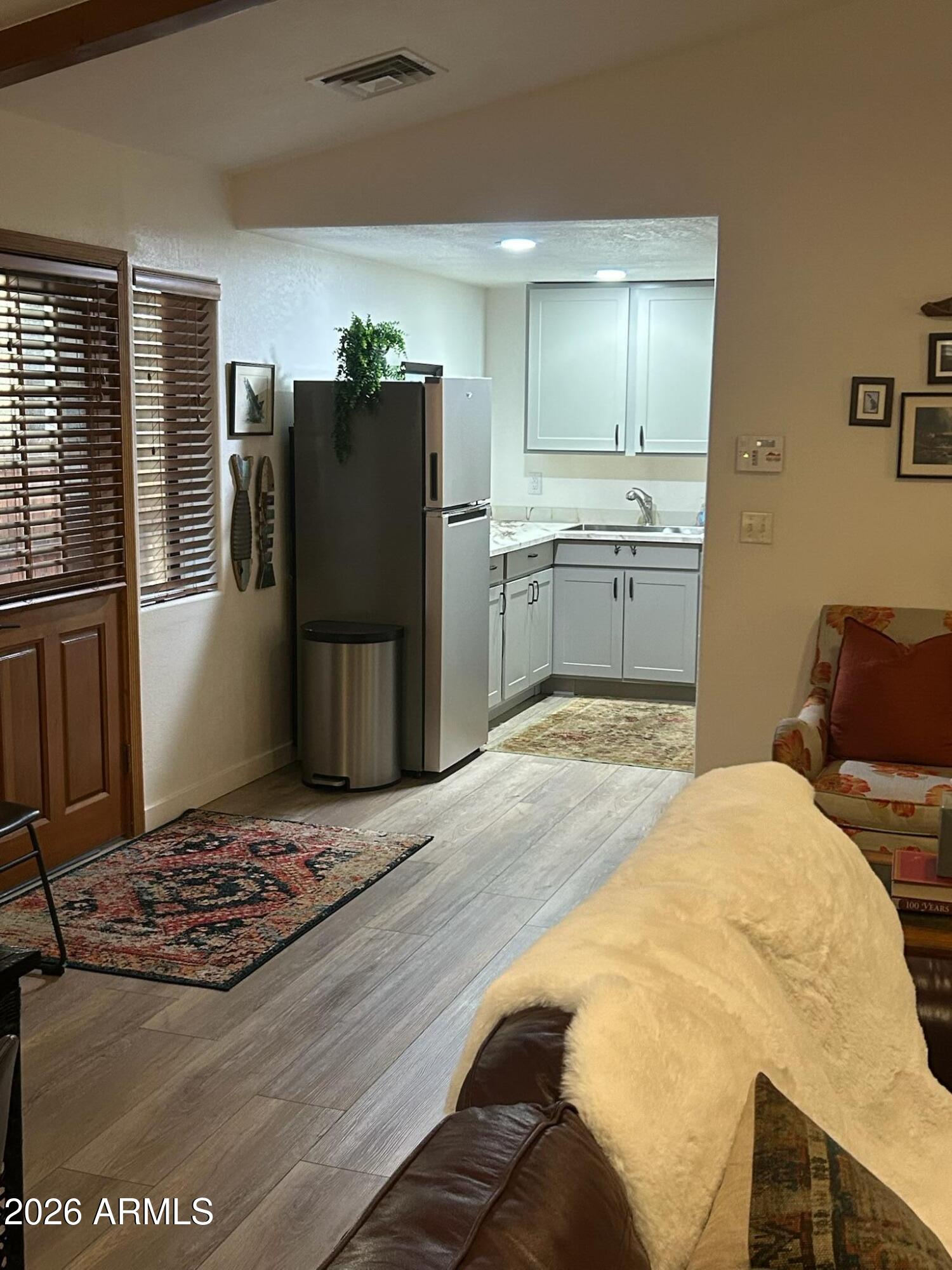 7414 Geronimo Road Pinetop, AZ 85935 - Photo 44 of 67 a kitchen with a refrigerator and a sink