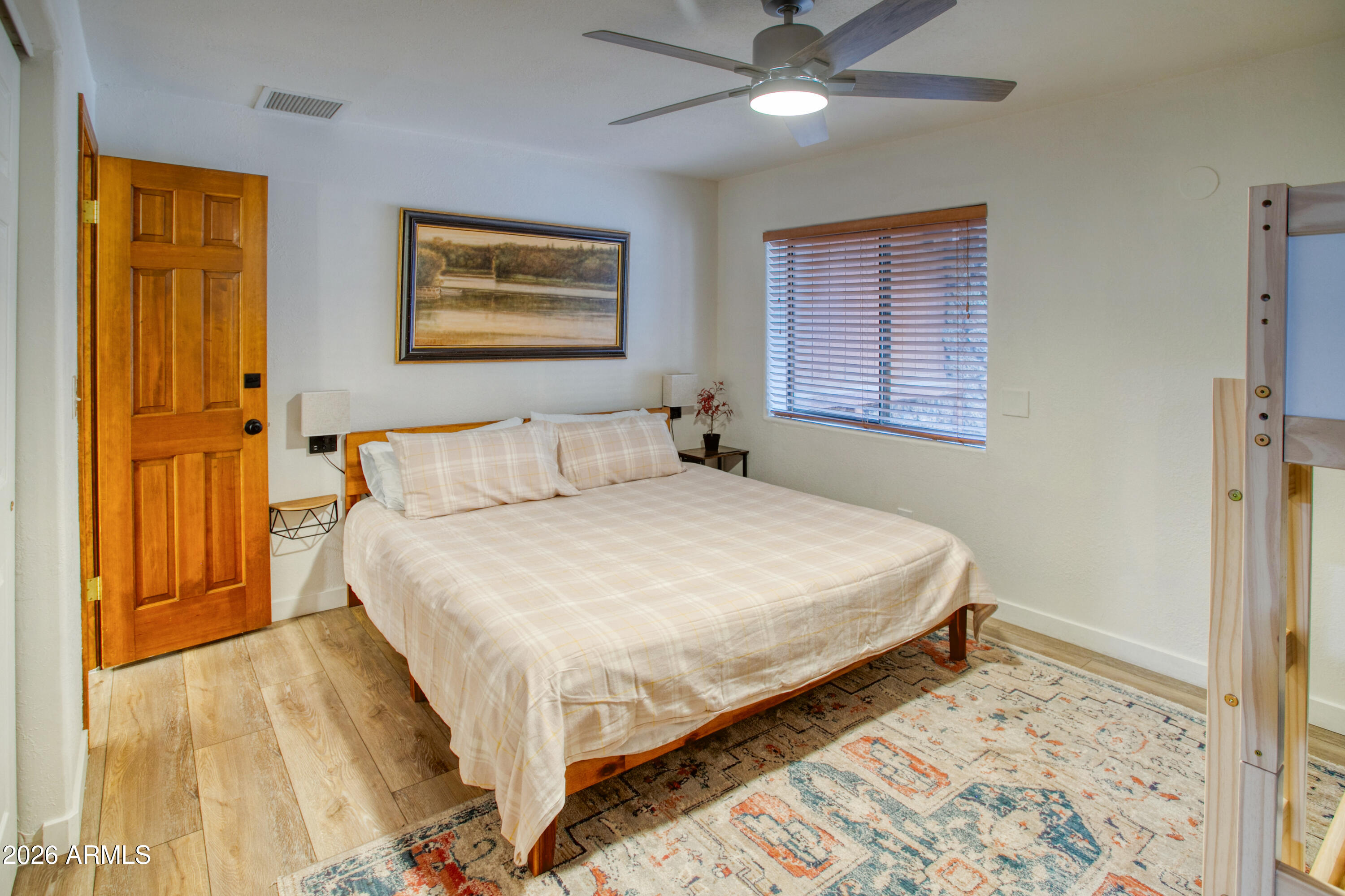 7414 Geronimo Road Pinetop, AZ 85935 - Photo 46 of 67 a bedroom with a bed and a window