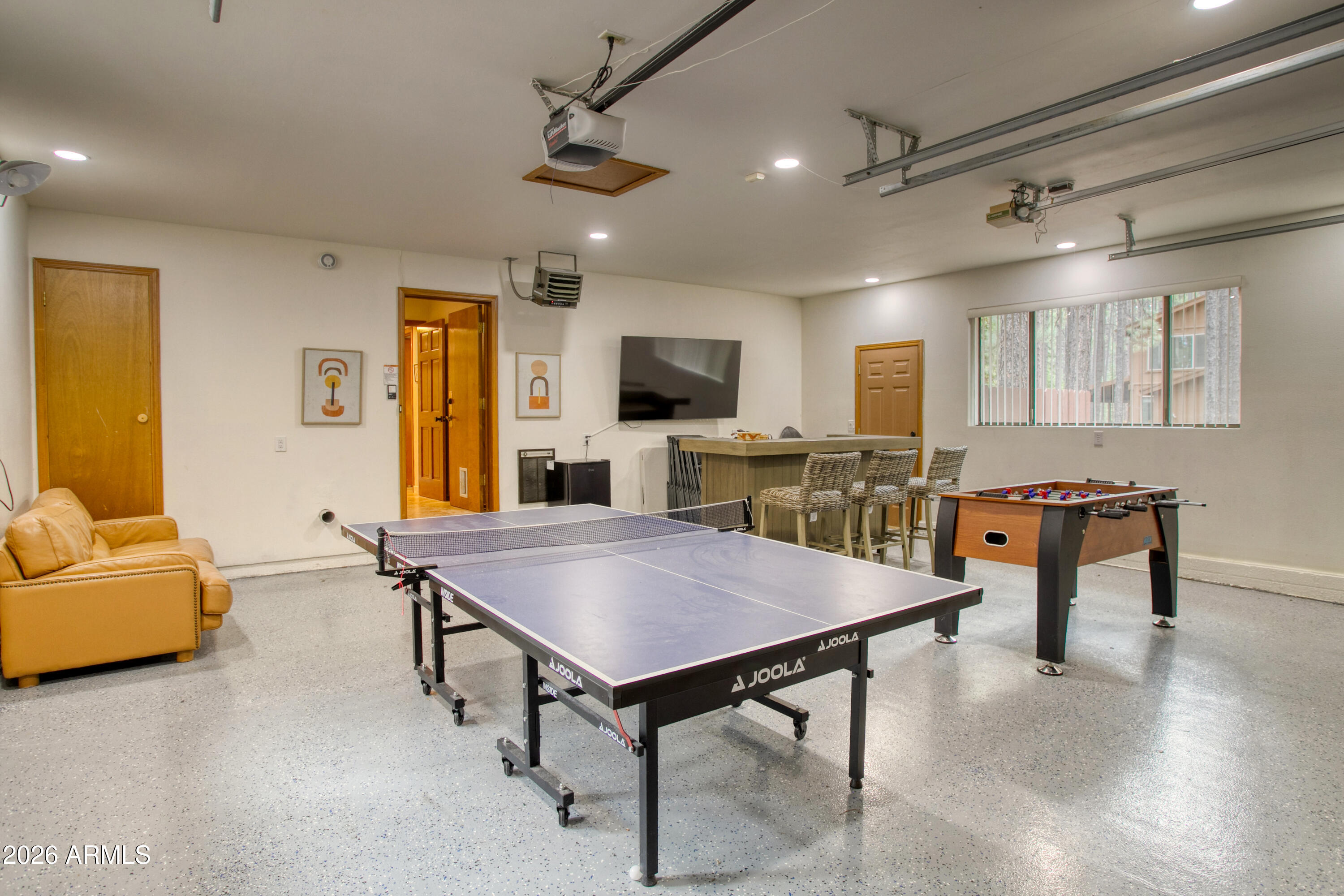 7414 Geronimo Road Pinetop, AZ 85935 - Photo 53 of 67 a living room with furniture and a flat screen tv
