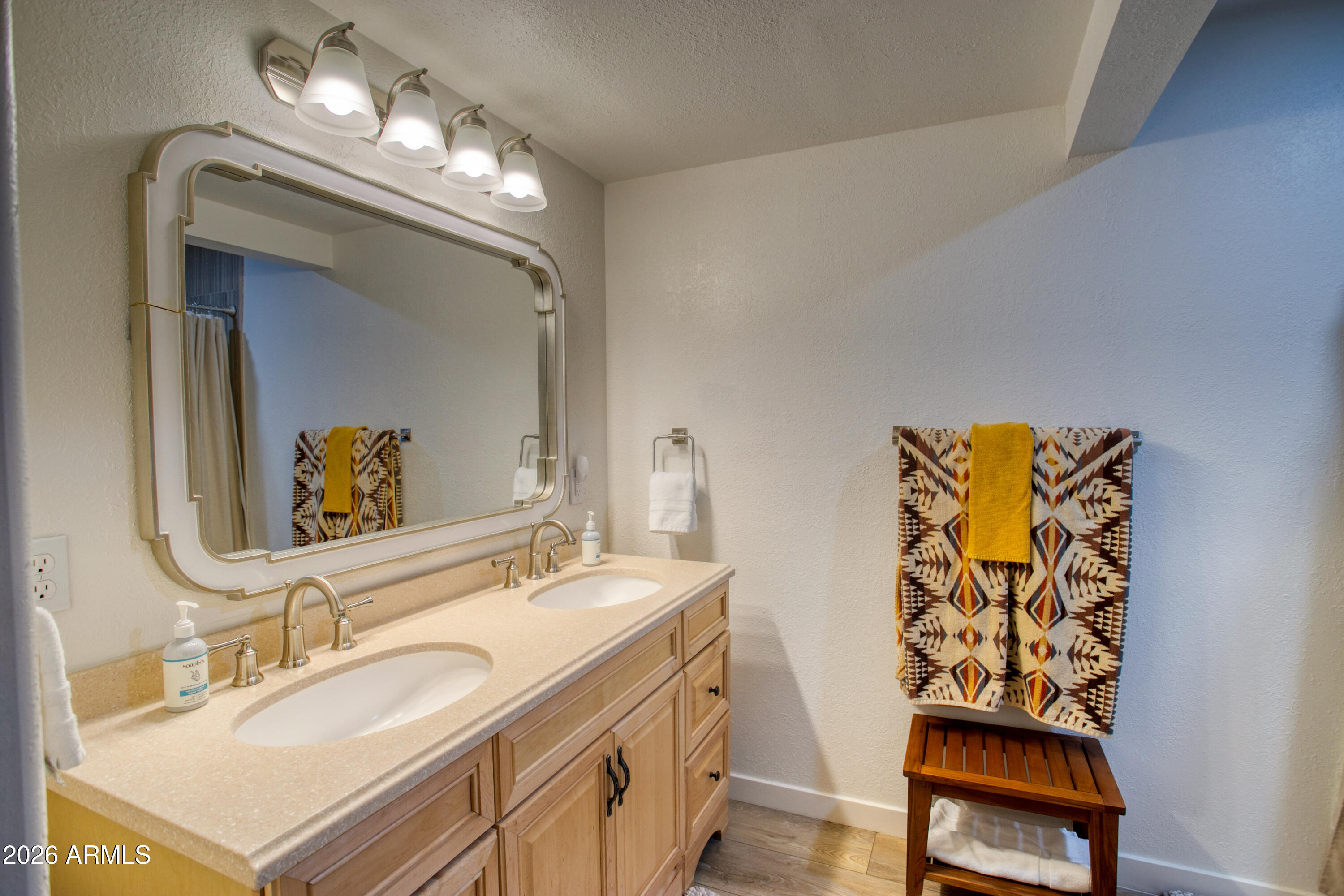 7414 Geronimo Road Pinetop, AZ 85935 - Photo 54 of 67 a bathroom with a sink and a mirror