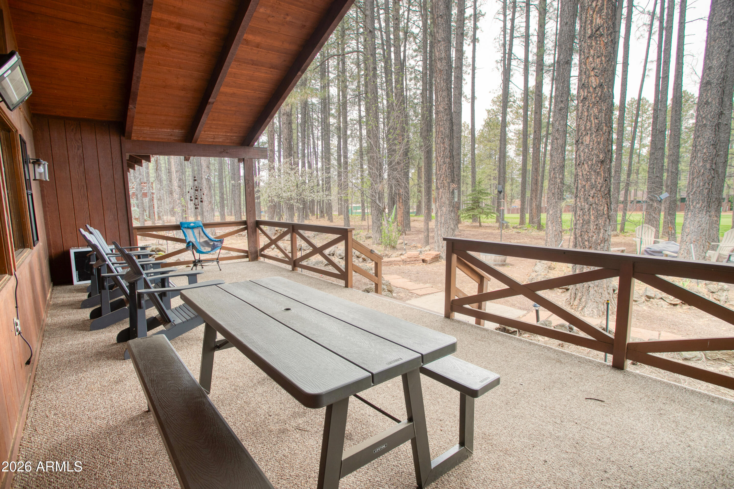 7414 Geronimo Road Pinetop, AZ 85935 - Photo 55 of 67 a view of a livingroom with furniture and a window