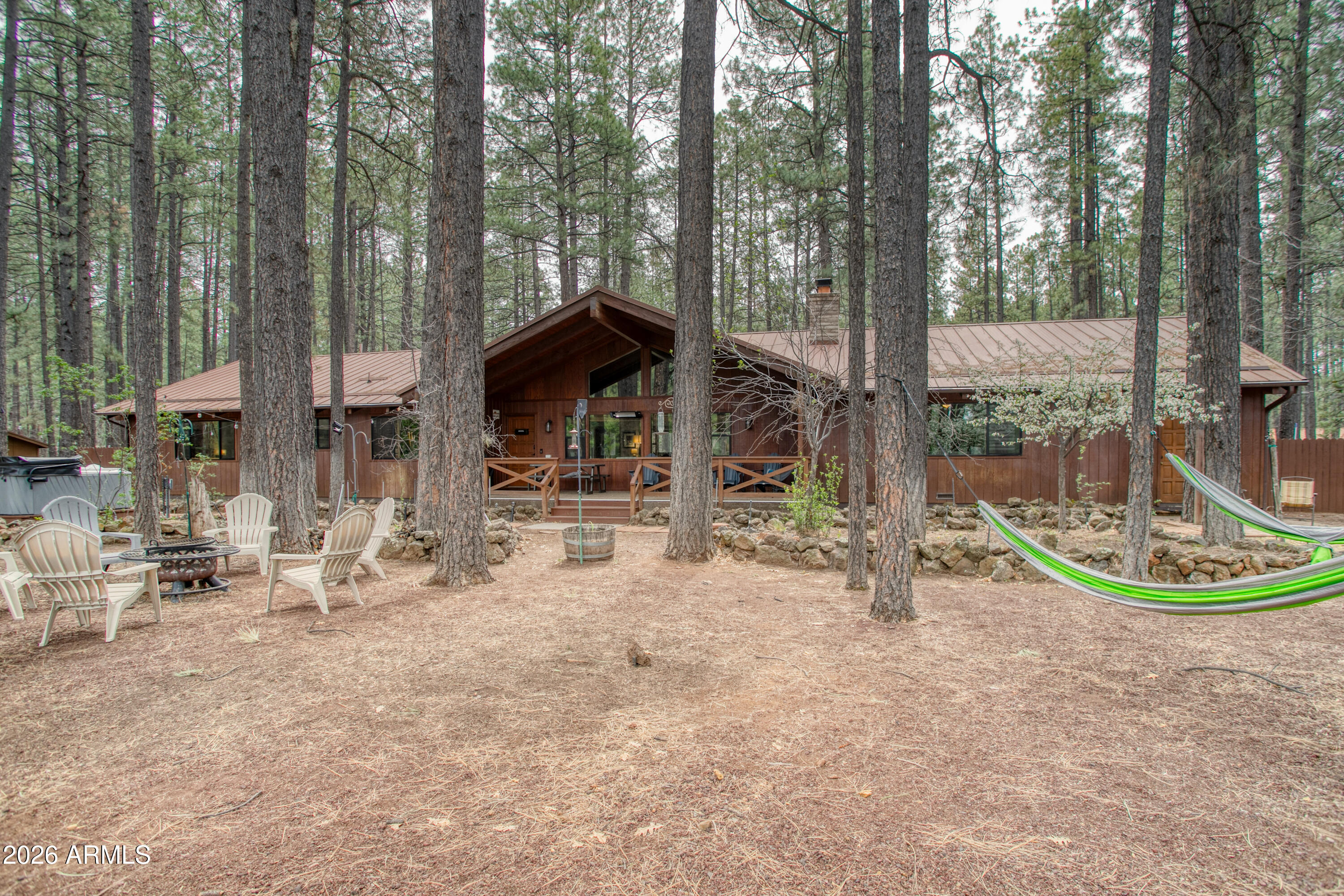 7414 Geronimo Road Pinetop, AZ 85935 - Photo 58 of 67 a view of a chair and table in the backyard