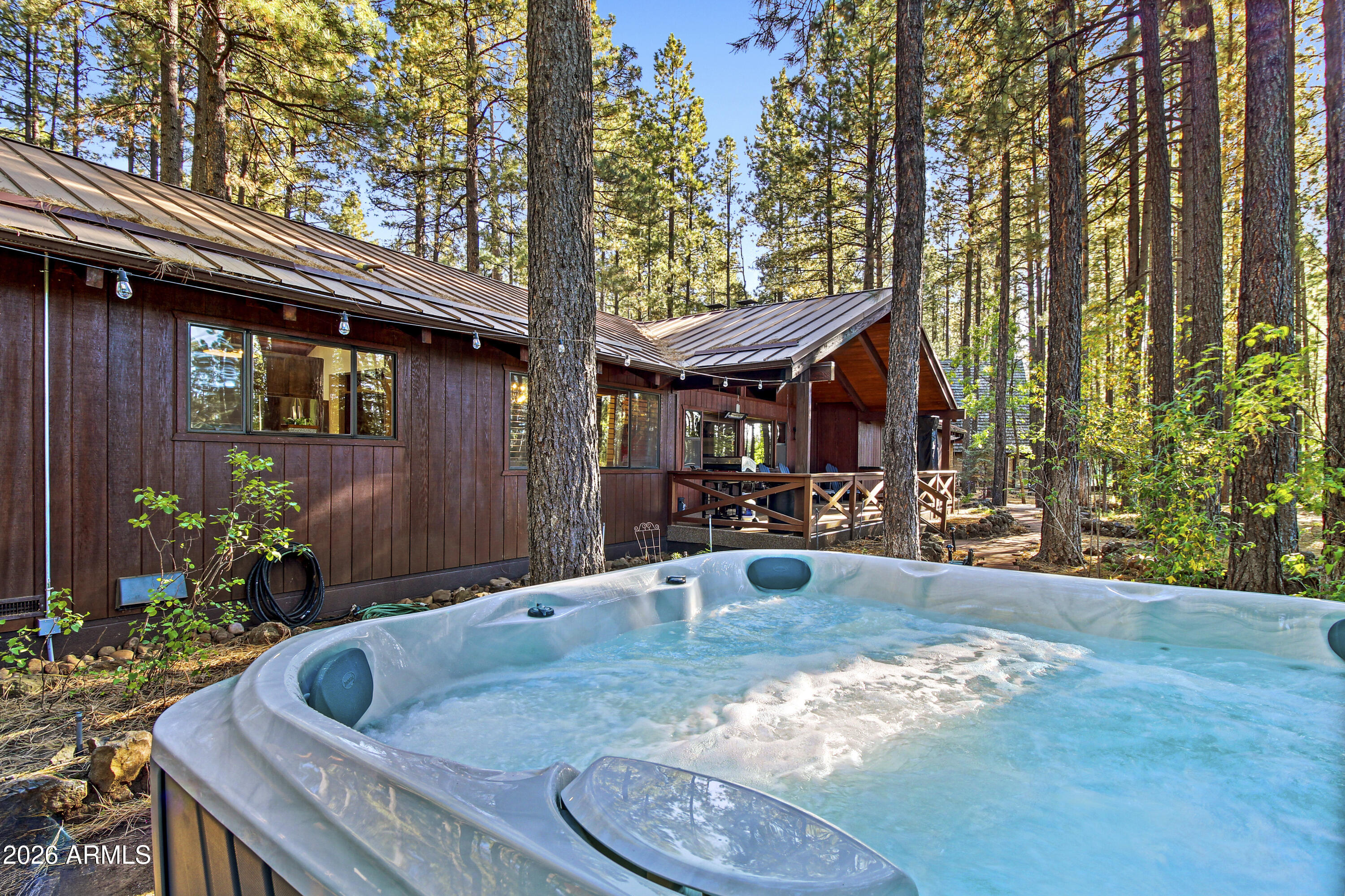 7414 Geronimo Road Pinetop, AZ 85935 - Photo 63 of 67 a view of a house with backyard and sitting area