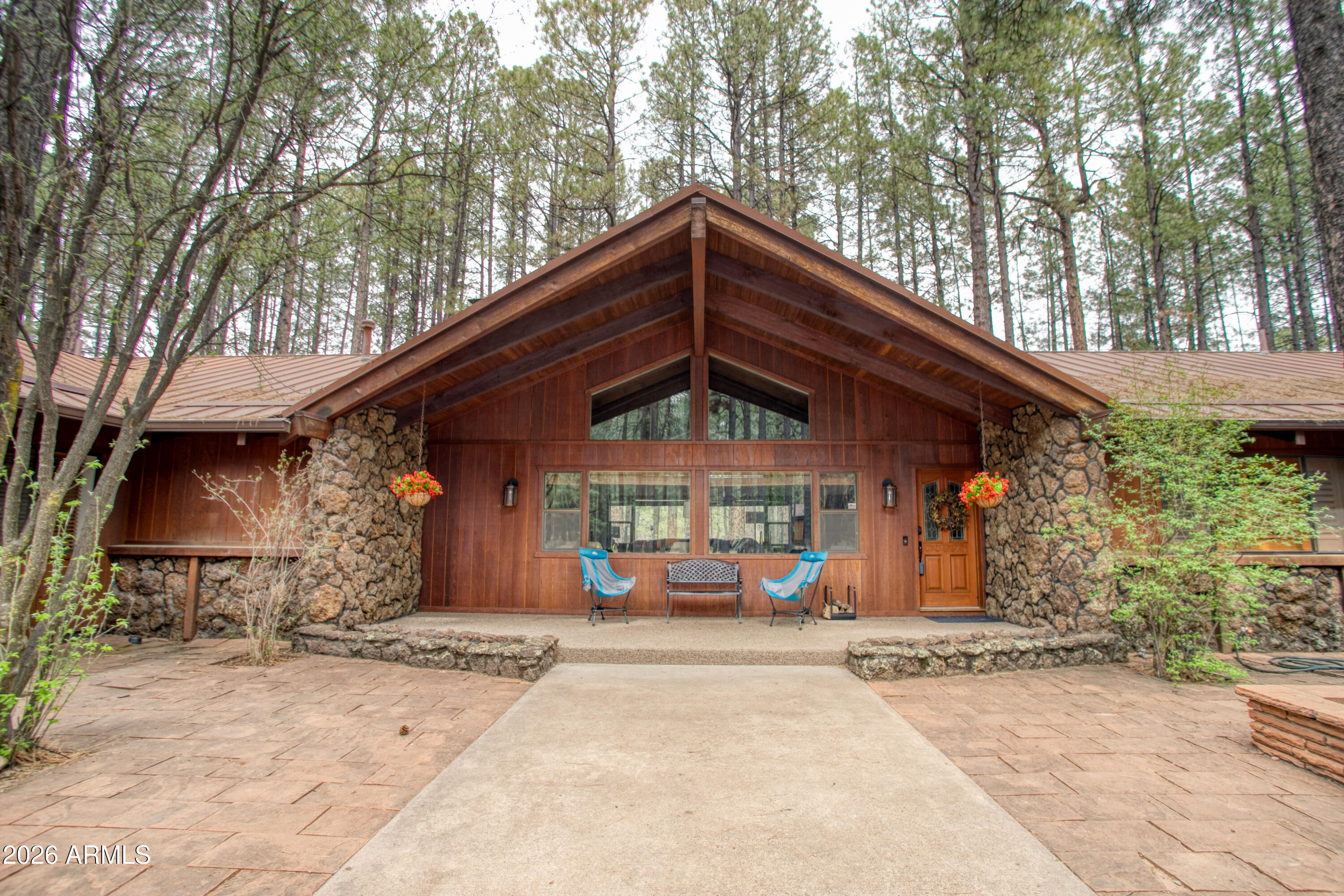 7414 Geronimo Road Pinetop, AZ 85935 - Photo 7 of 67 a front view of a house with a yard