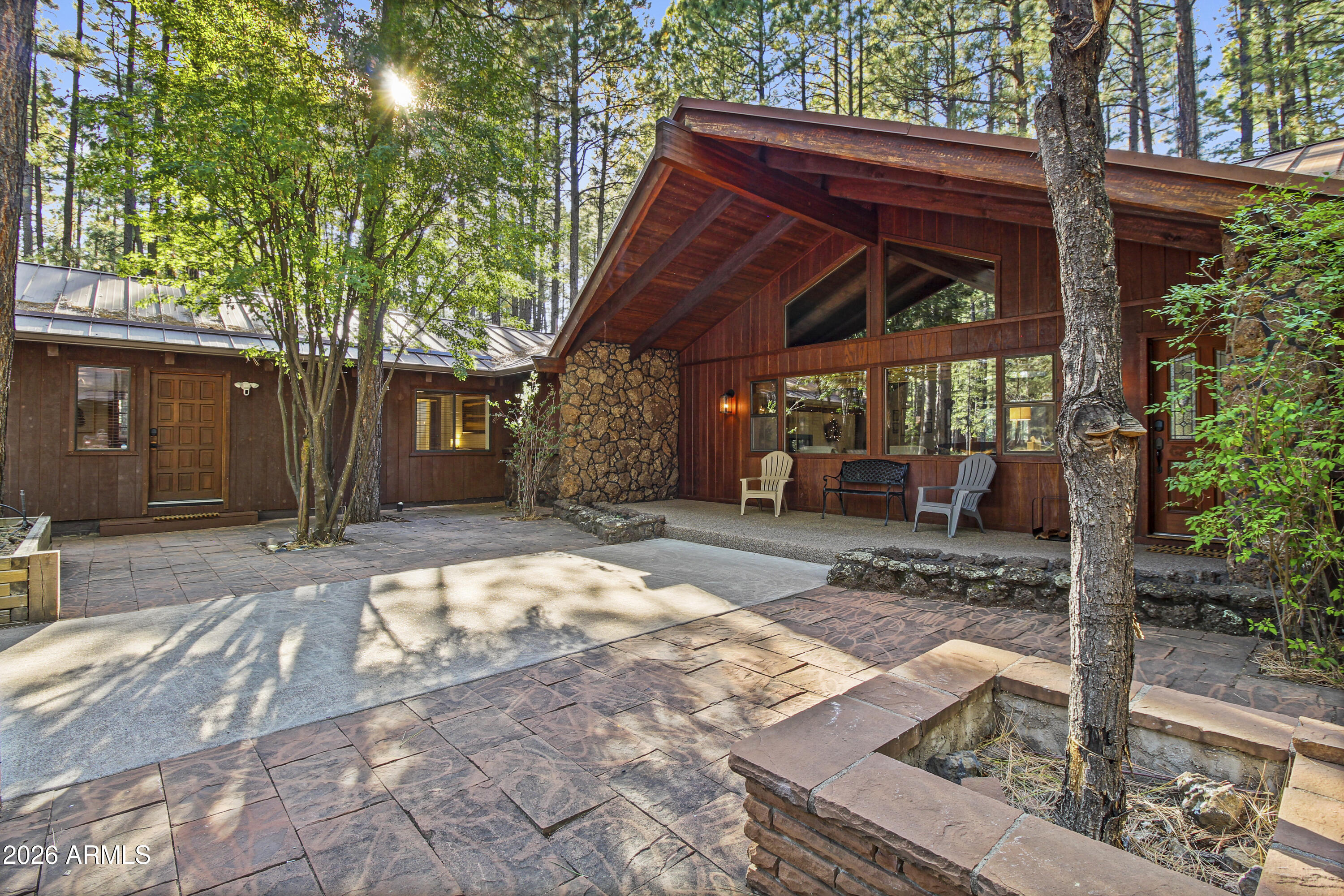 7414 Geronimo Road Pinetop, AZ 85935 - Photo 9 of 67 a wooden bench sitting in front of a house