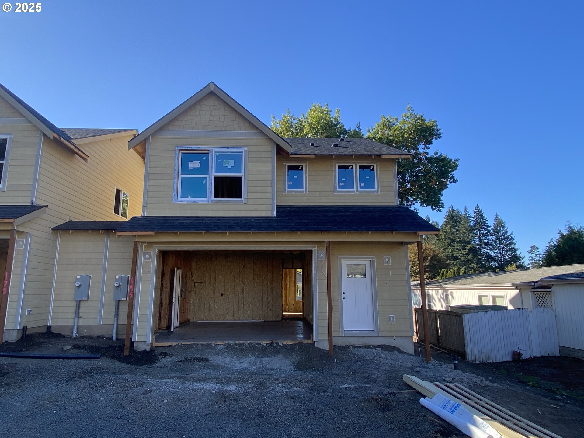 a front view of a house with a garage
