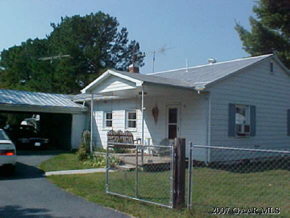 483 Dooms Crossing Road Waynesboro, VA 22980 - Photo 1 of 5 a front view of a house with a garden