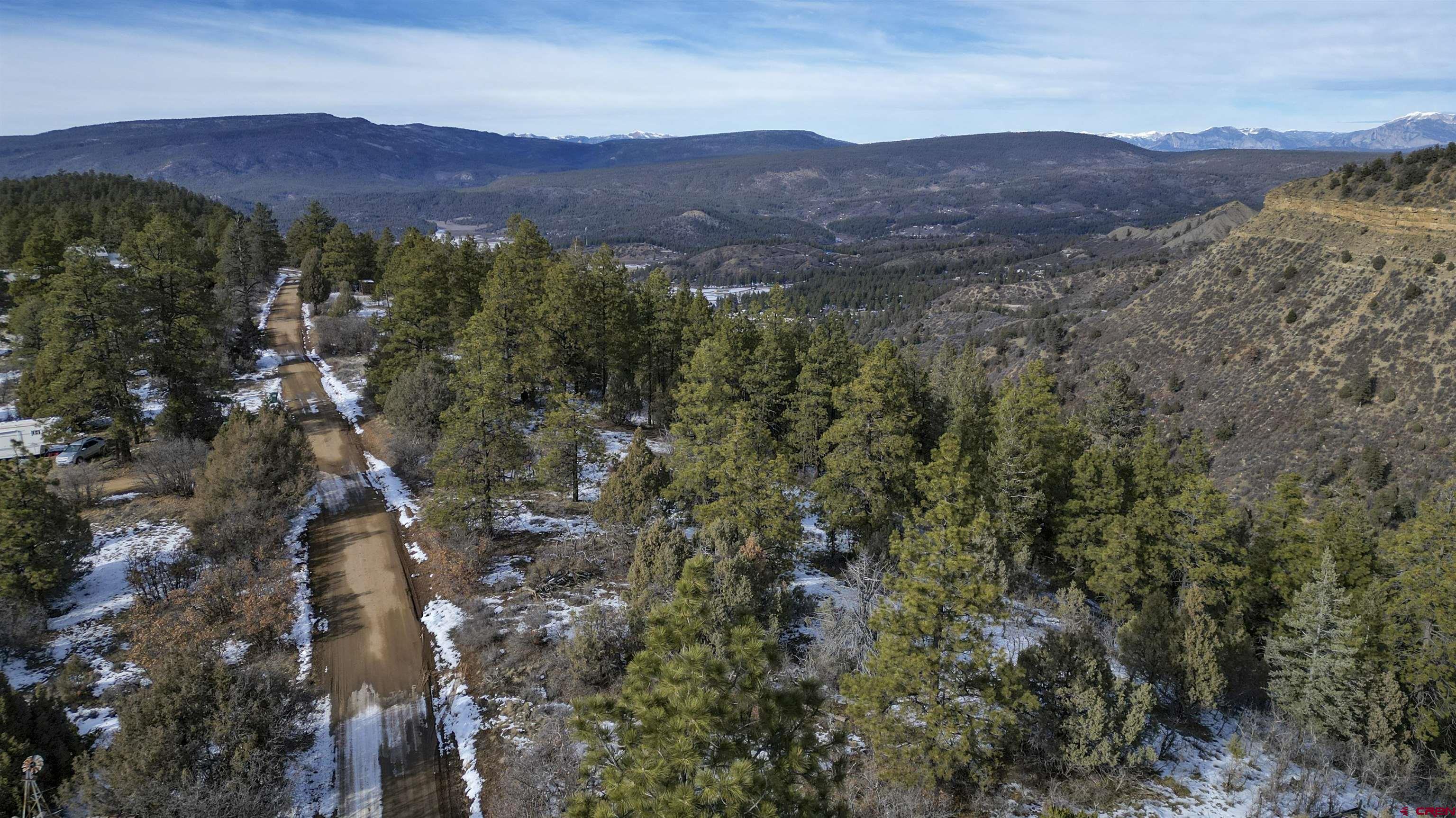 783 Gun Barrel Road Pagosa Springs, CO 81147 - Photo 22 of 28 a view of a lush green hillside and houses