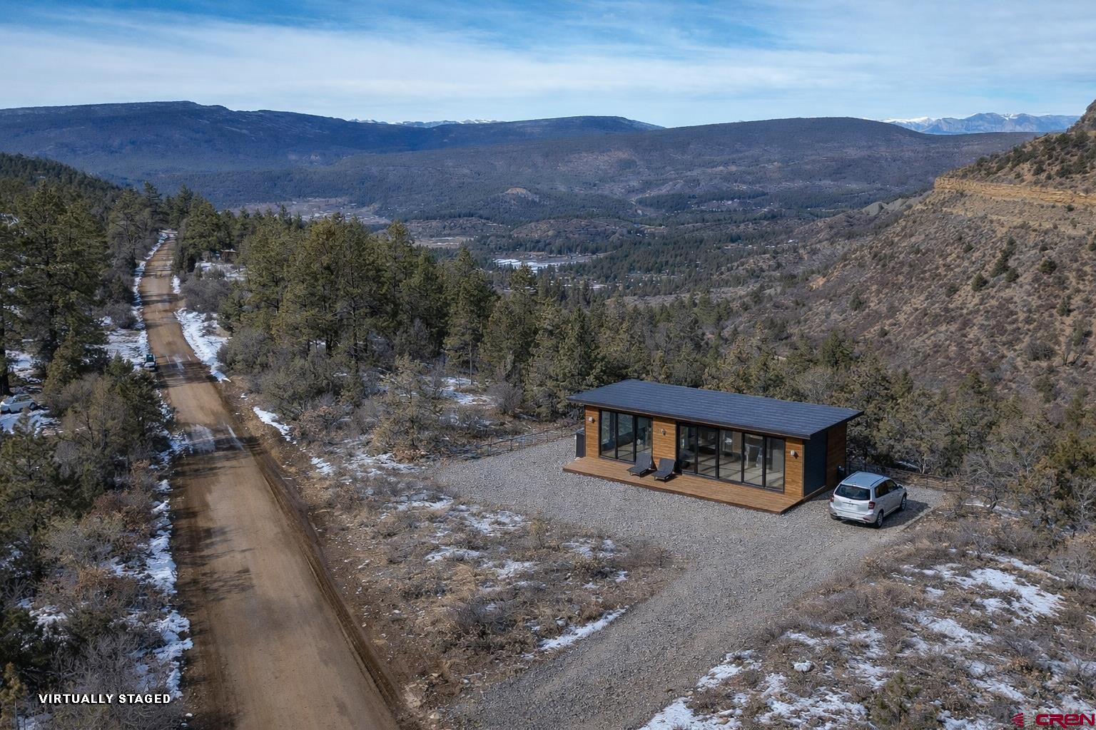 783 Gun Barrel Road Pagosa Springs, CO 81147 - Photo 24 of 28 a view of a house with a yard