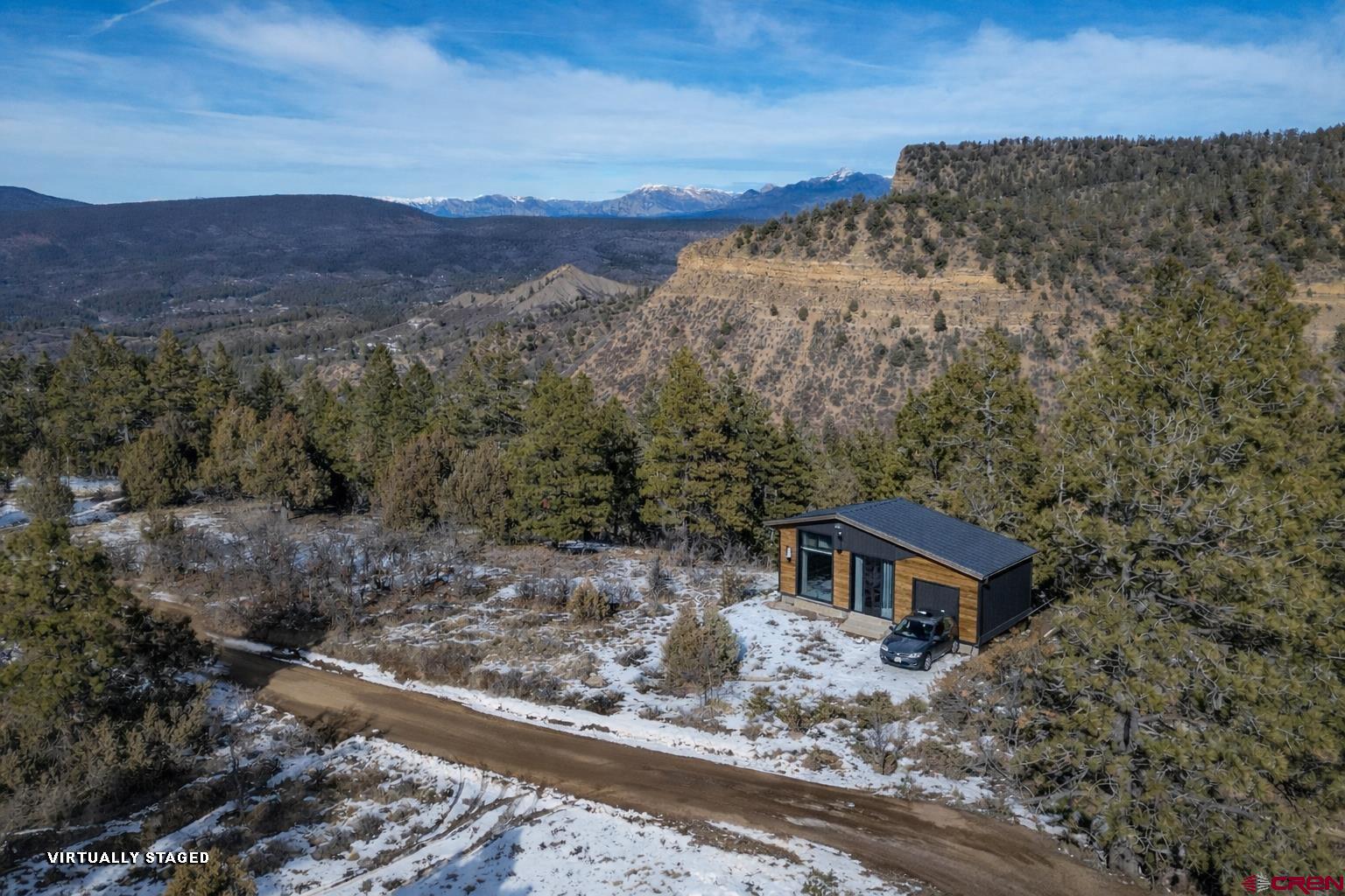 783 Gun Barrel Road Pagosa Springs, CO 81147 - Photo 26 of 28 a view of a house with a mountain