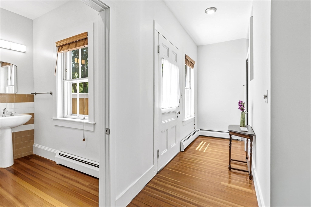 58 Front Street Northampton, MA 01053 - Photo 38 of 42 a view of a hallway with wooden floor and staircase