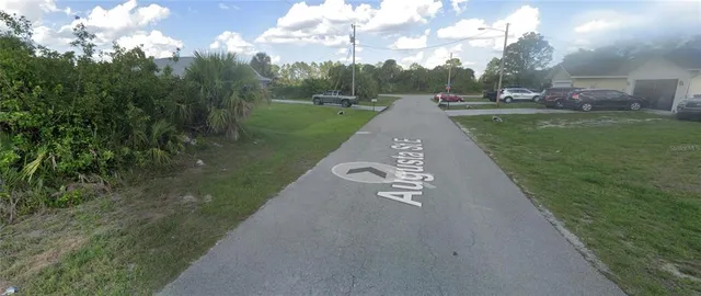 a view of a street with a yard