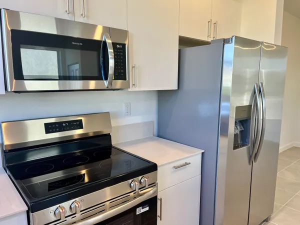a kitchen that has a sink and a stove