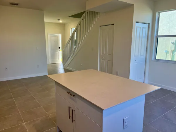 a view of a backyard with wooden fence