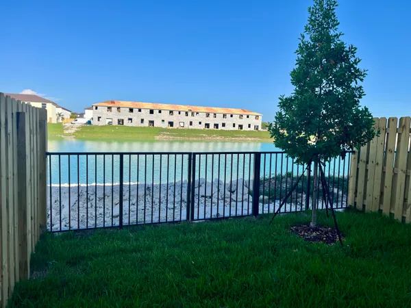 a view of a livingroom with wooden floor staircase and hallway