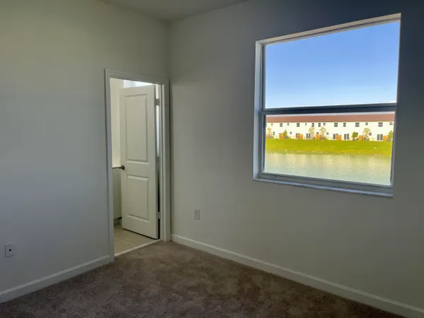 a view of a hallway with a wooden door