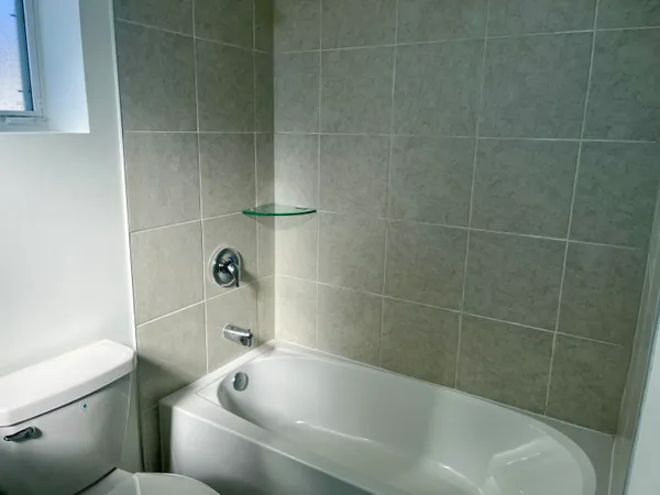 a bathroom with a shower and a bathtub